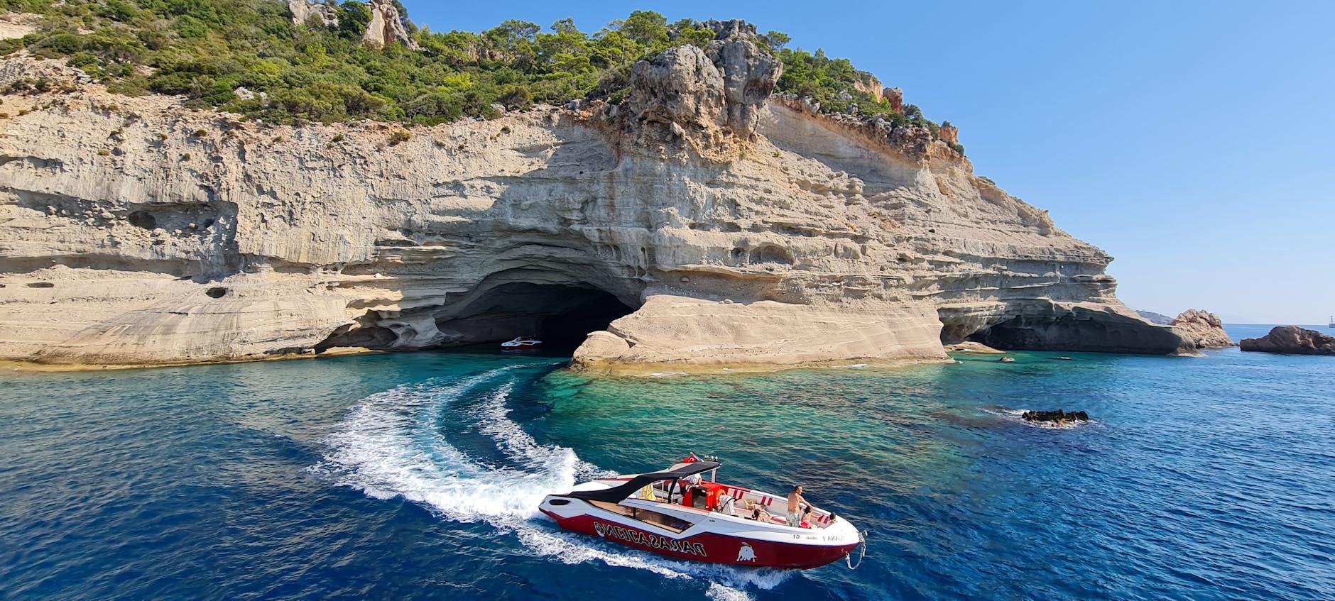 A Motorboat Sailing on the Blue Water of the Sea