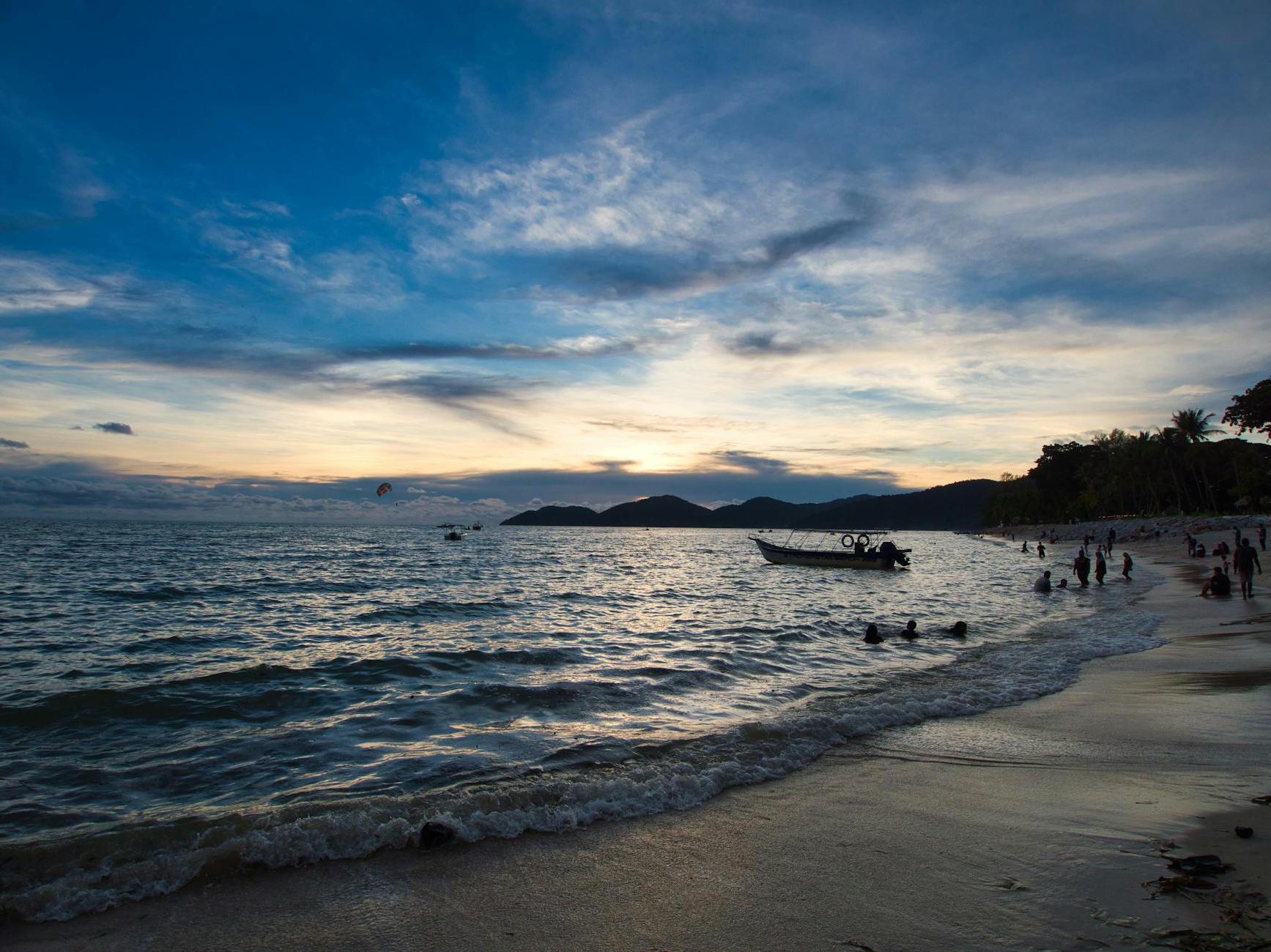 People on the Beach during Sunset