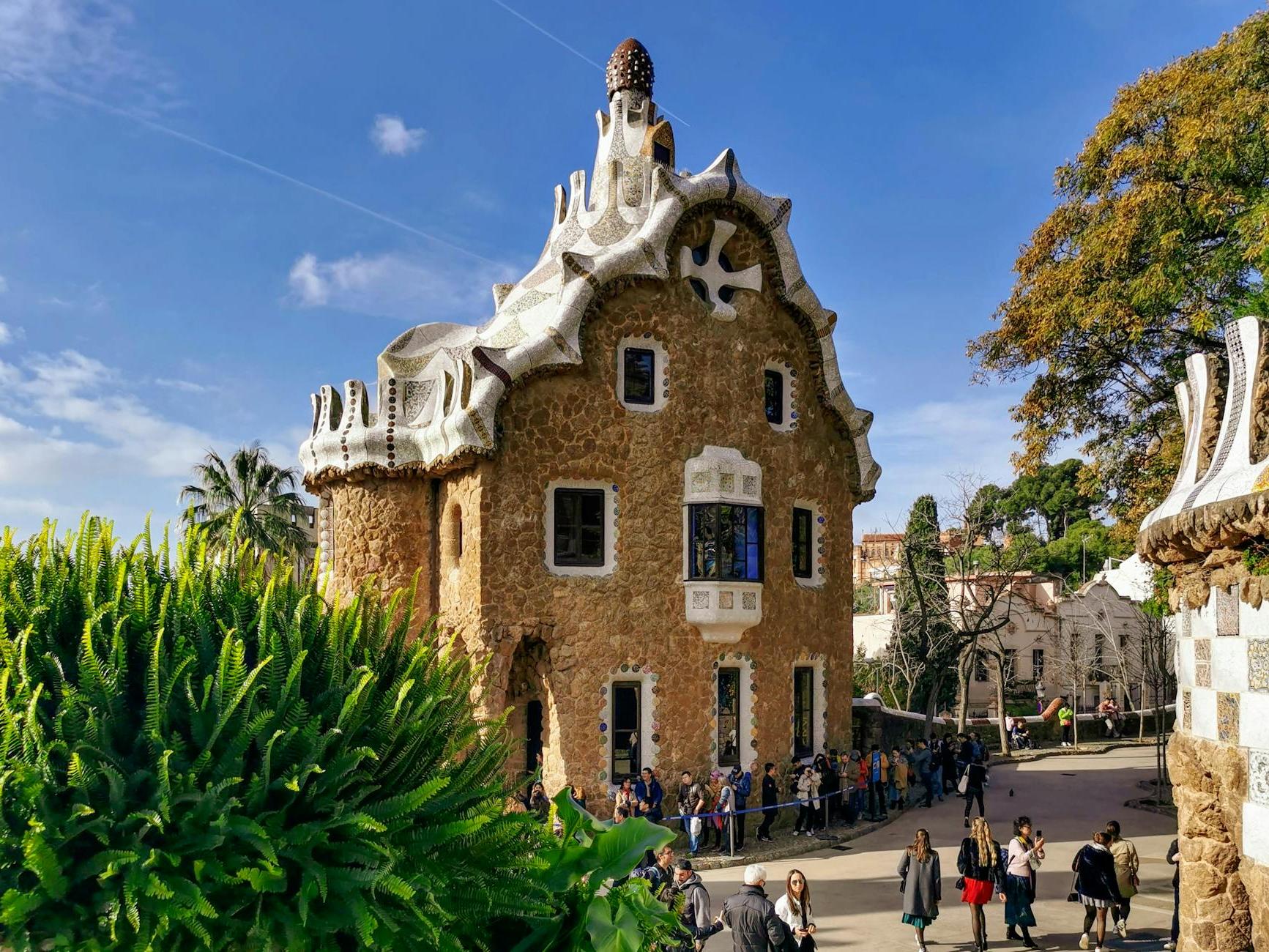 Tourists Visiting the Casa del Guarda Gatehouse in Barcelona Spain