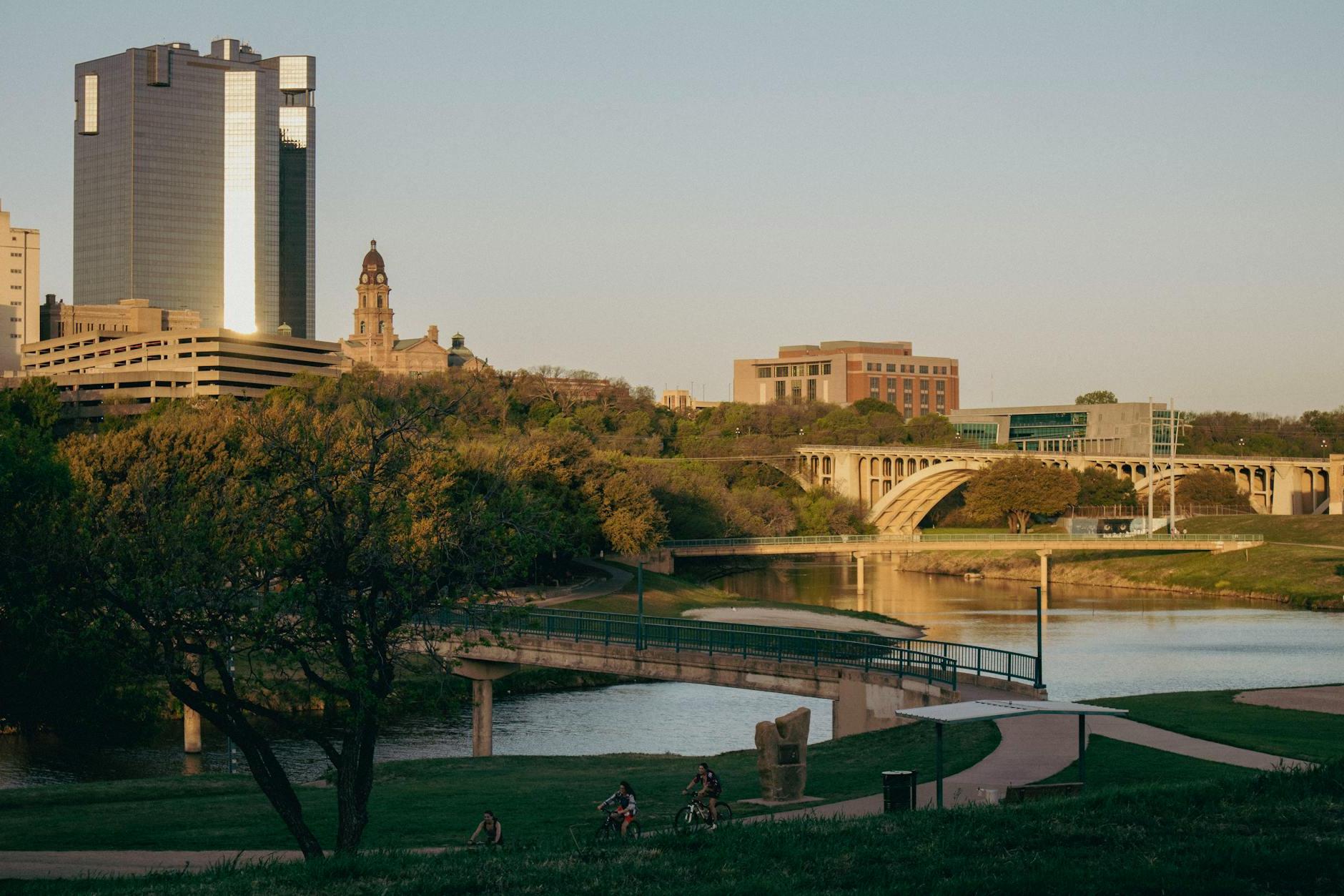 Park and Bridge near River in City Downtown