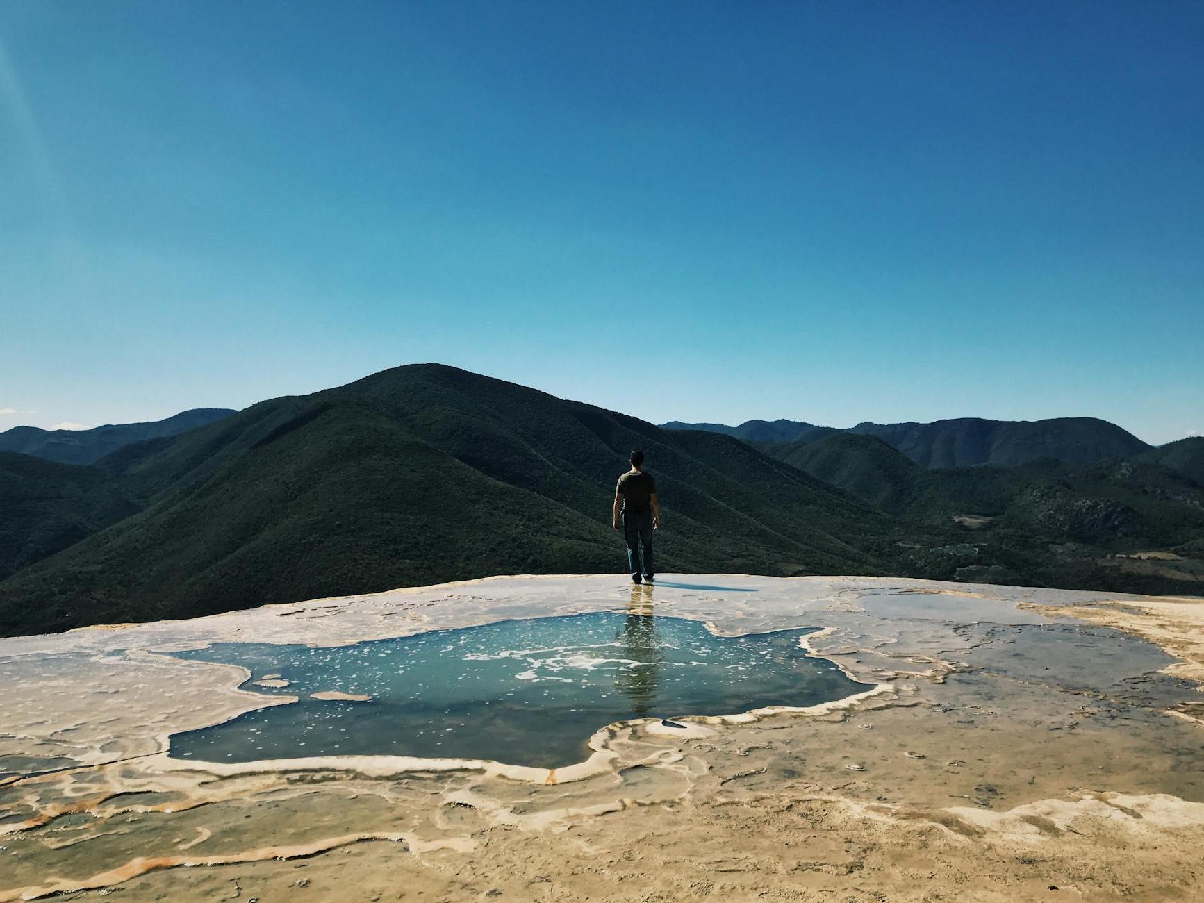 Tourist Walking Along the Calcified Bank of the Spring in Hierve el Agua Nature Reserve