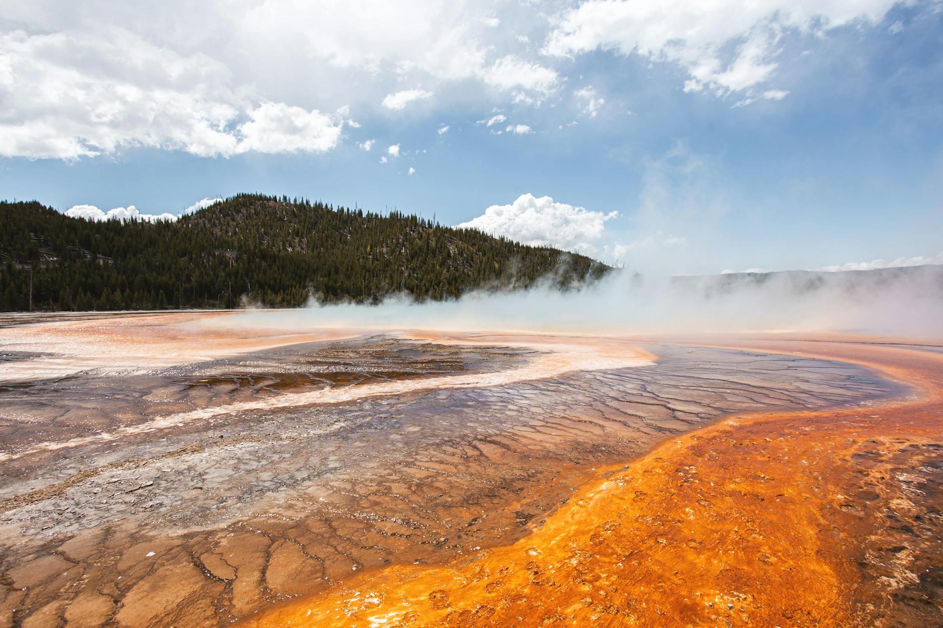 Landscape of a Steaming Ground by a Hill in the Yellowstone National Park, USA