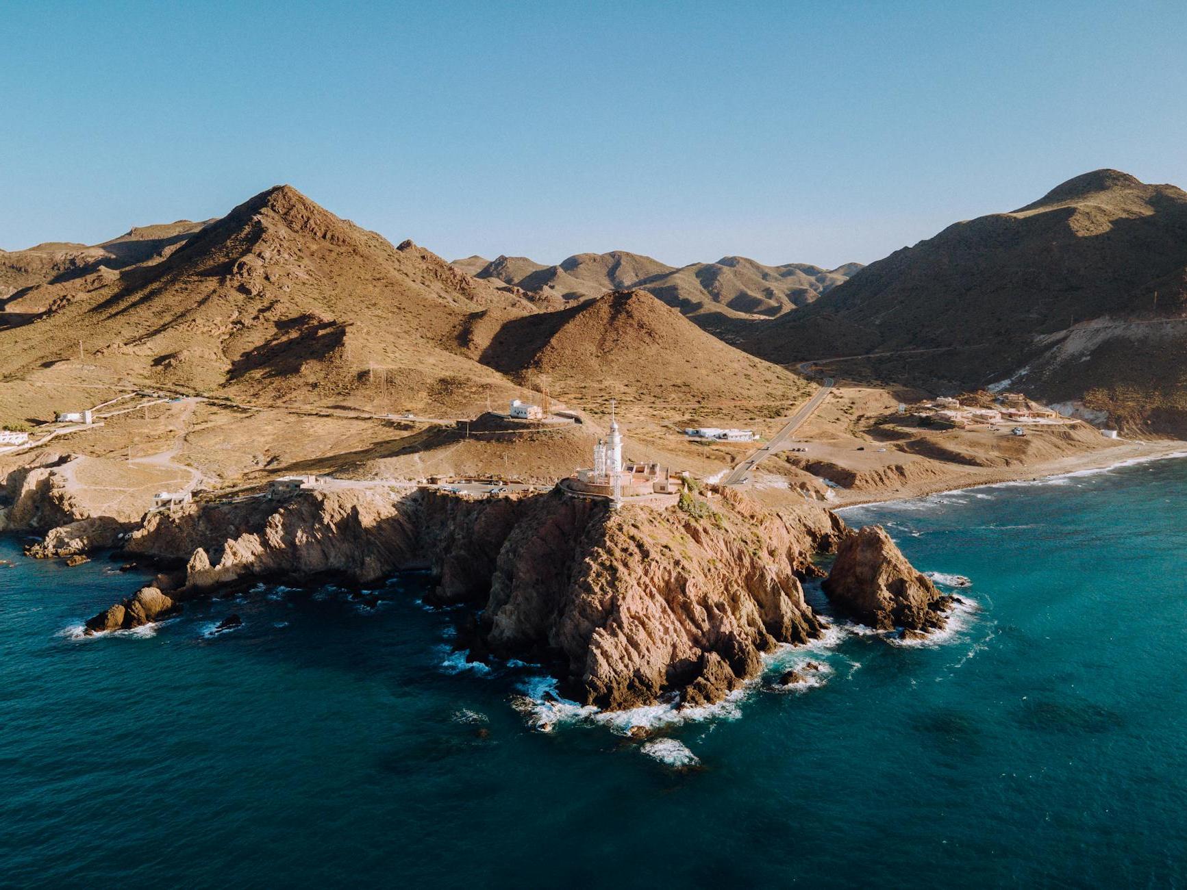 Lighthouse on Cliff on Seashore