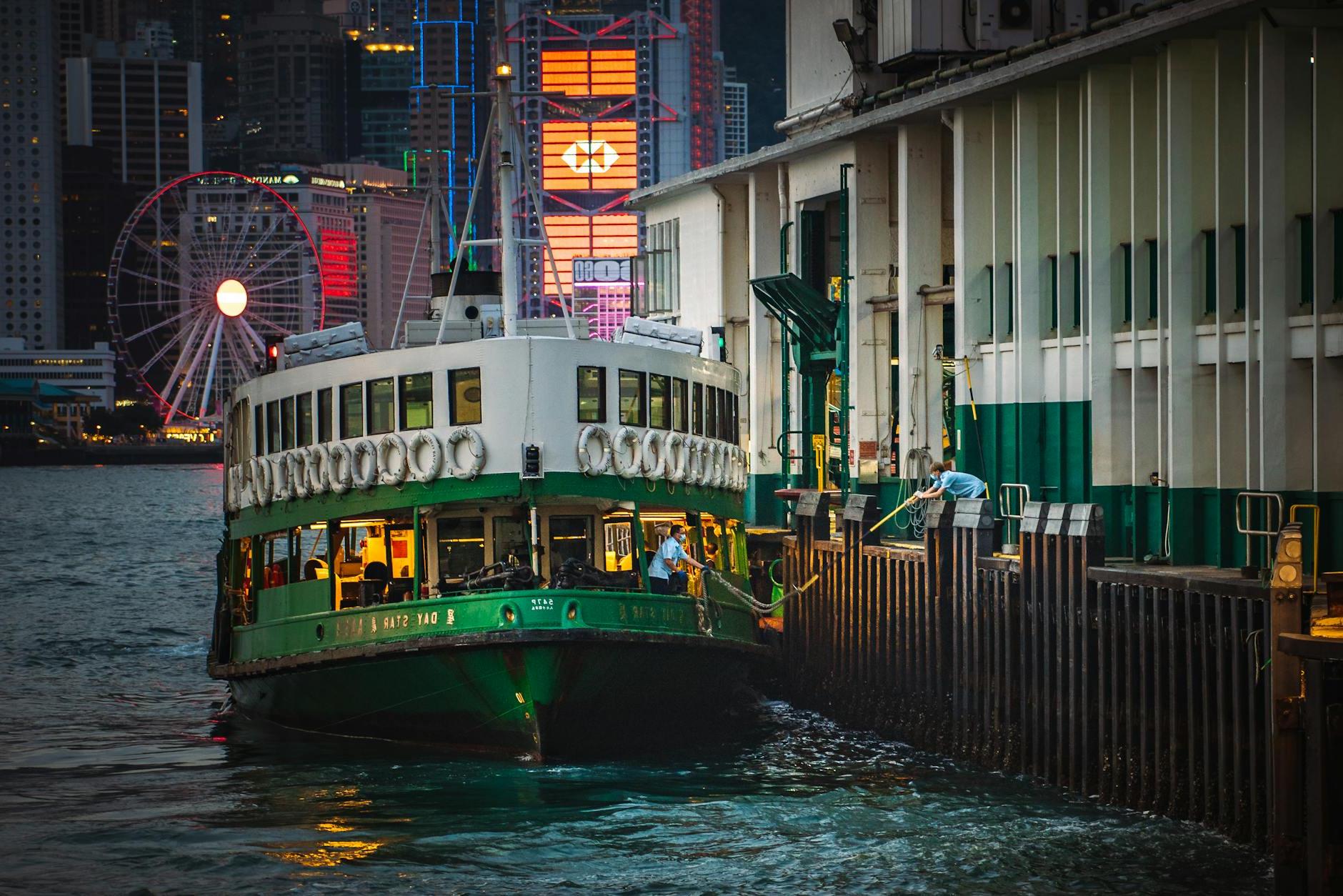 Cruise Ship on River in City at Night