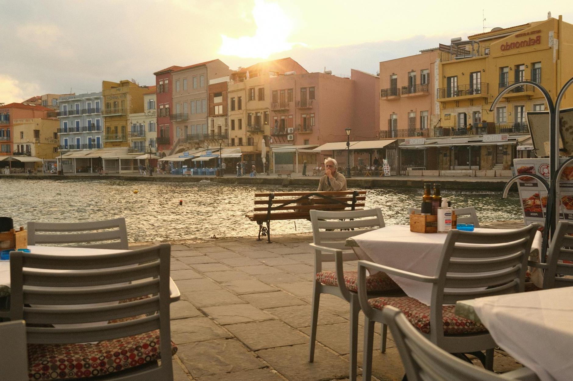 Cafe Tables near Sea in Coastal Town on Sunset