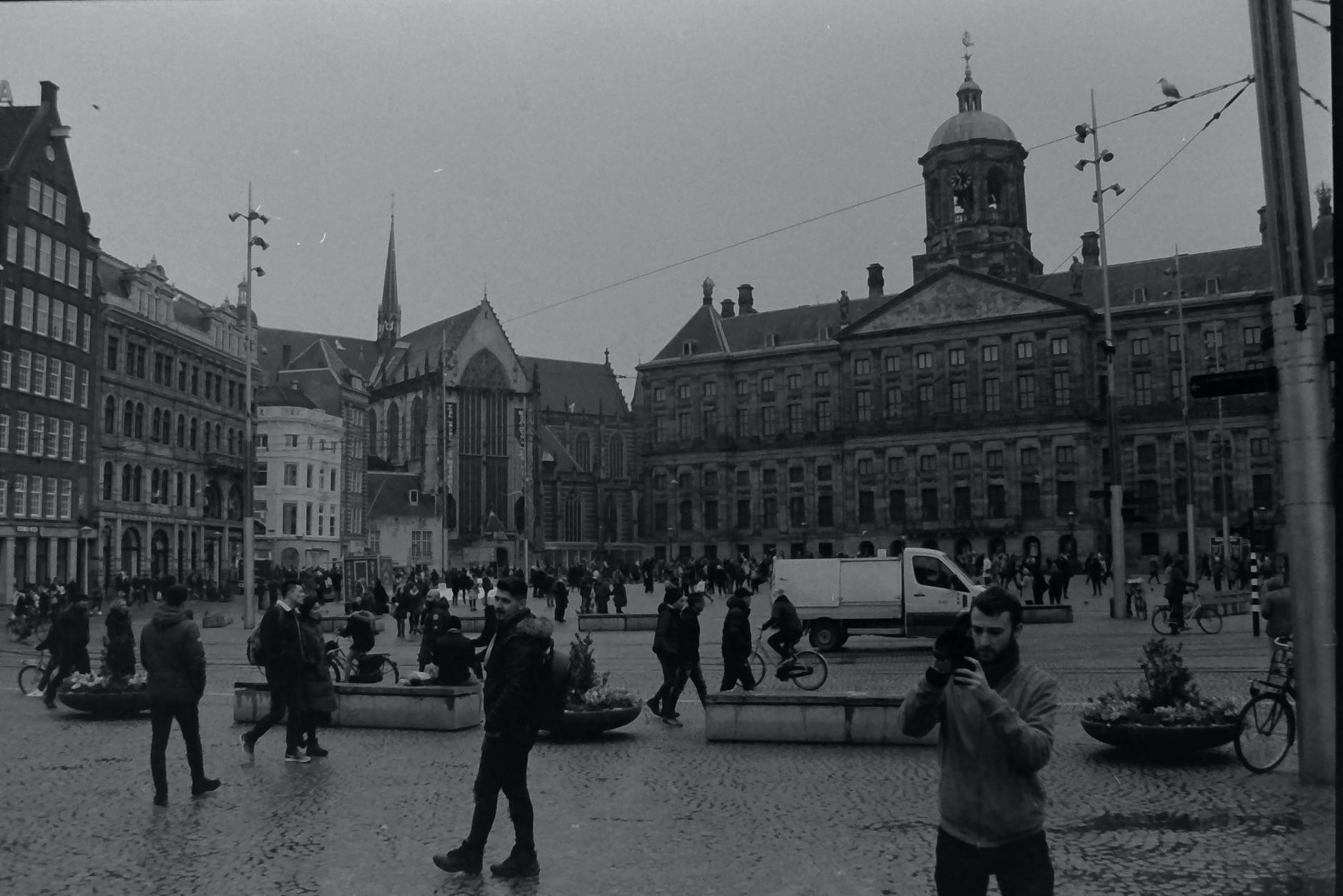 People Walking Near The Royal Palace of Amsterdam on Dam Square