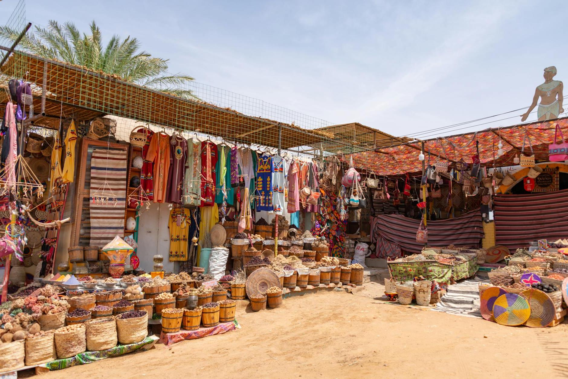 Photo of a Bazaar with Multicoloured Textiles and Decoration in Sunlight