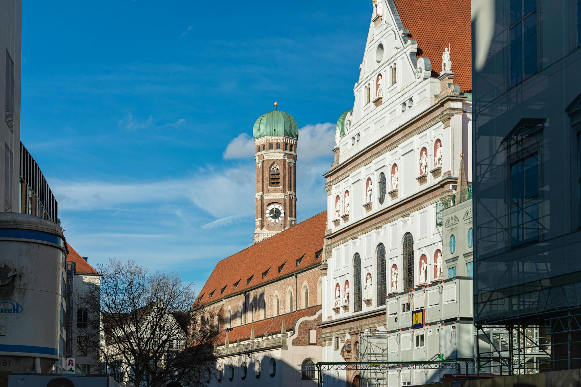 Facade of the St. Michaels Church and Tower of the Frauenkirche in Munich, Bavaria, Germany