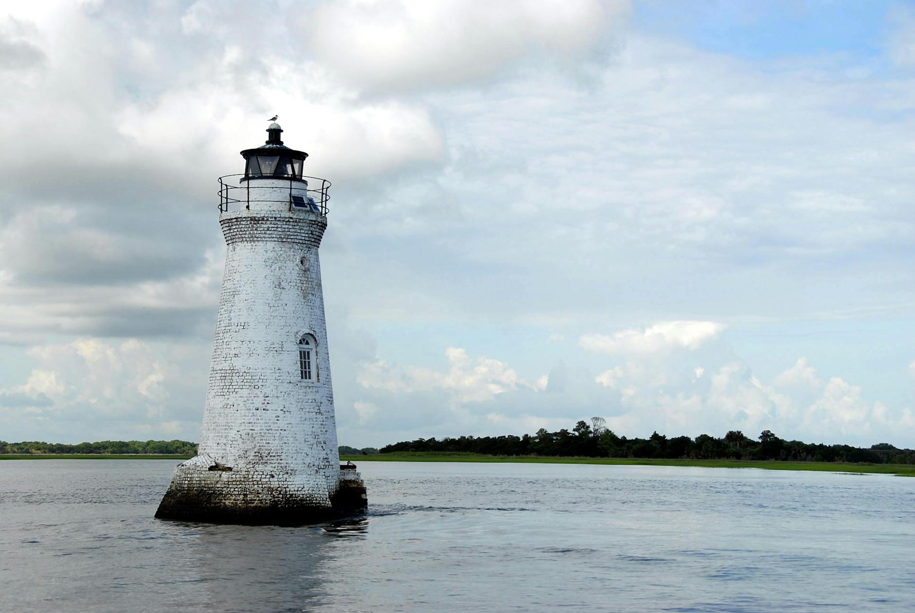 White Light House in the Middle of Sea