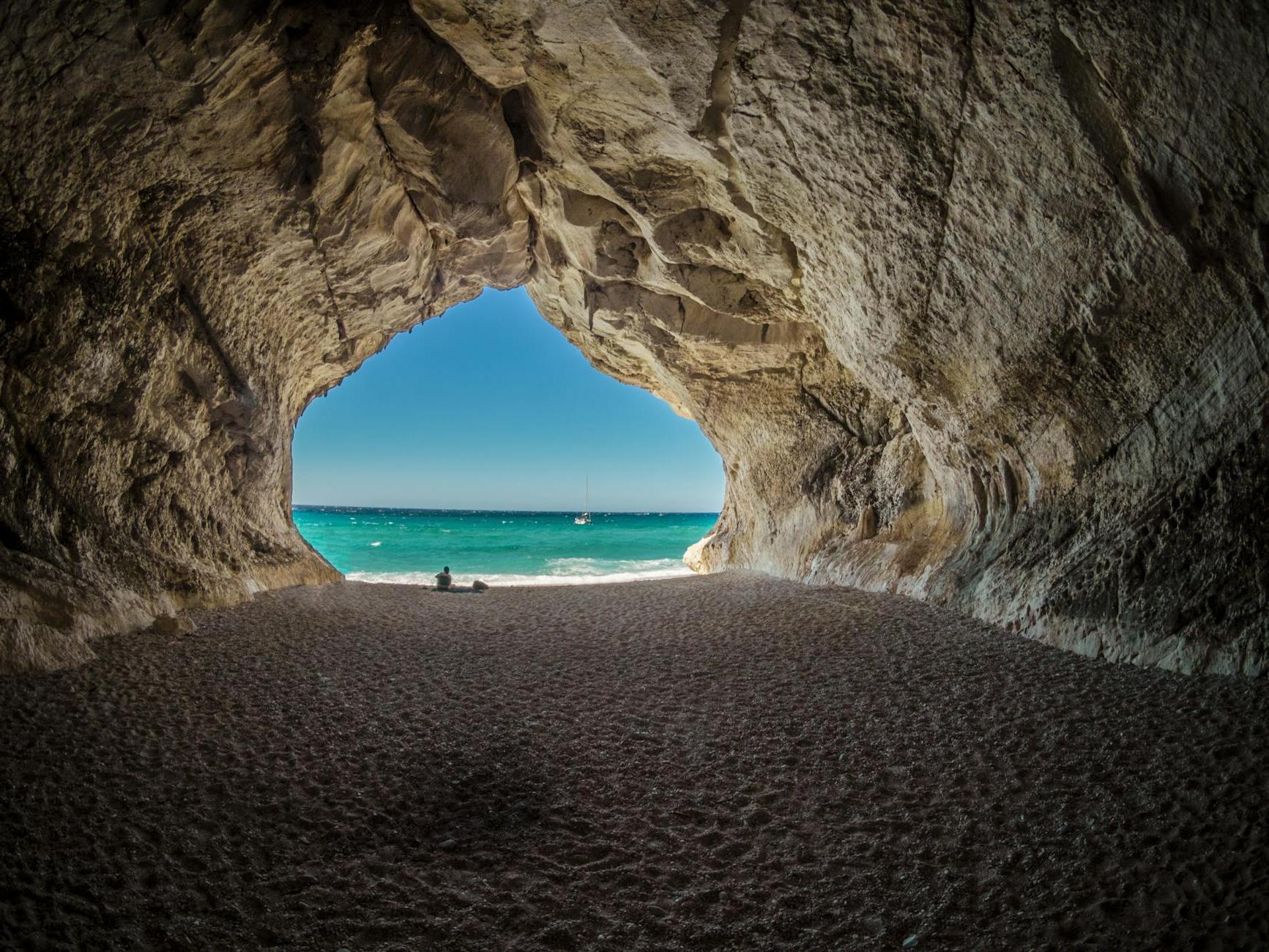 Brown Tunnel Near Body of Water