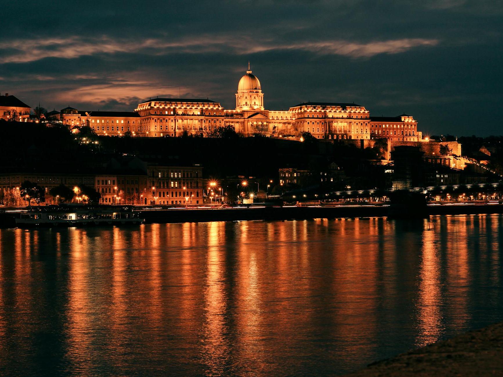 Illuminated Buda Castle seen from the River Danube in Budapest, Hungary