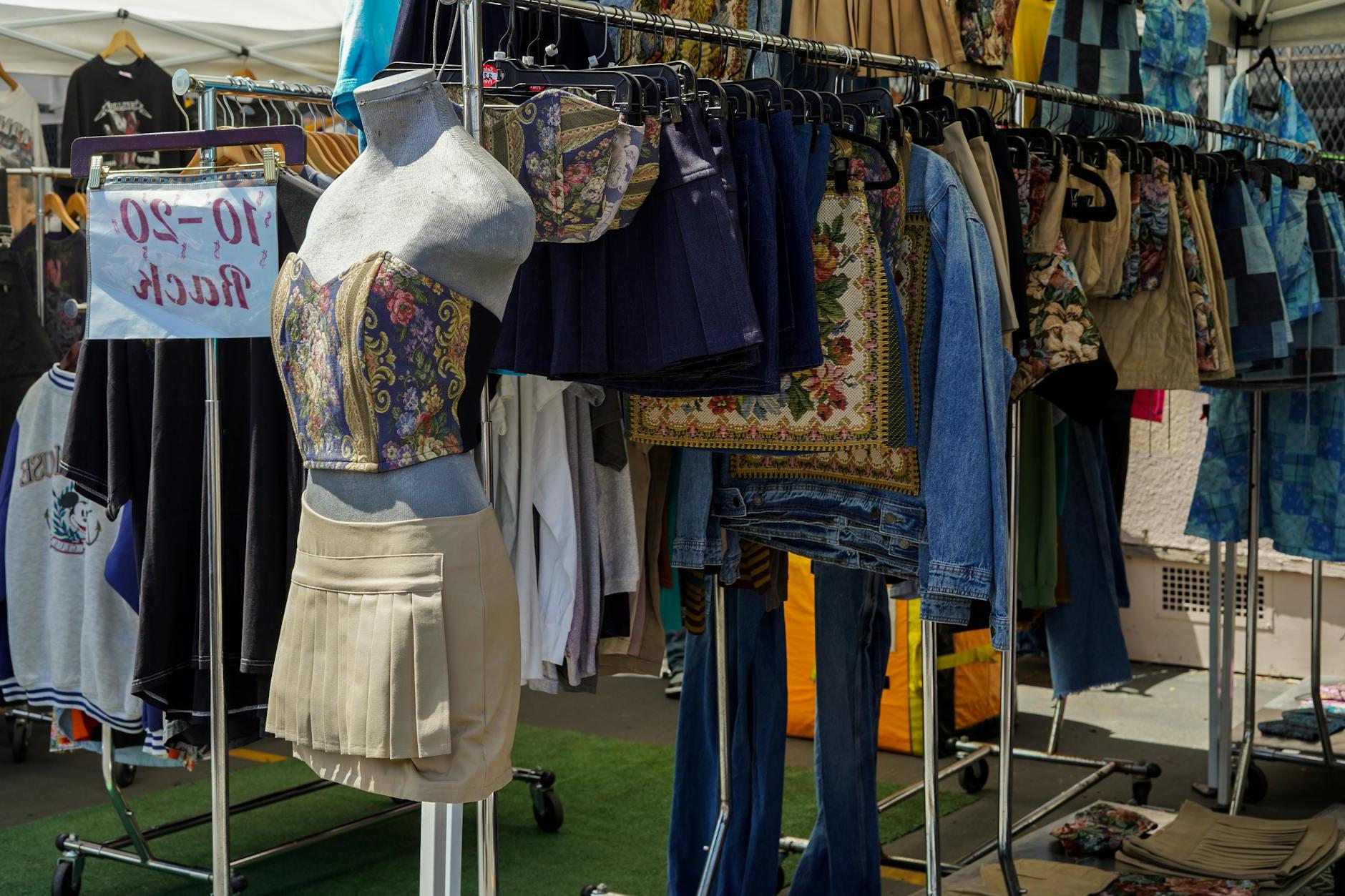 Close-up of Clothes Hanging on a Clothing Rack at a Flea Market