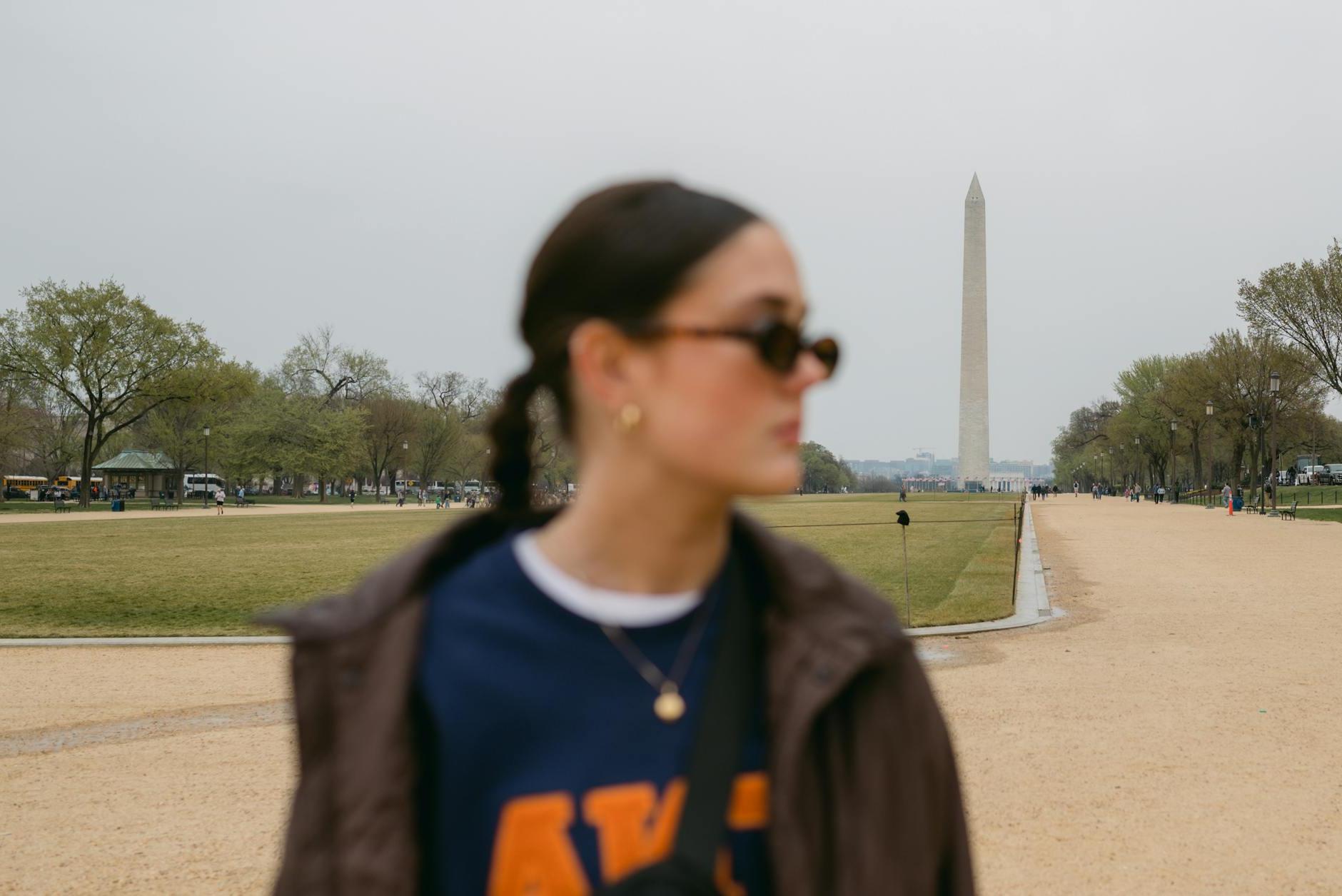 Blurred Photograph of a Woman Wearing Sunglasses in a Park