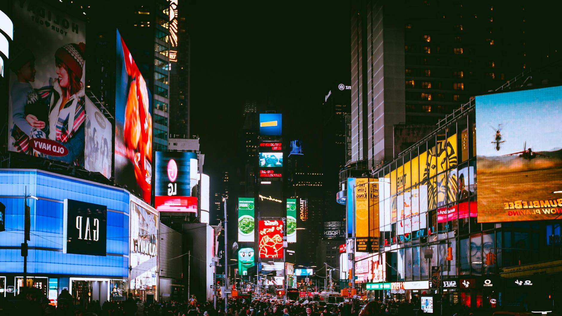 Crowd of People on Street With City Lights