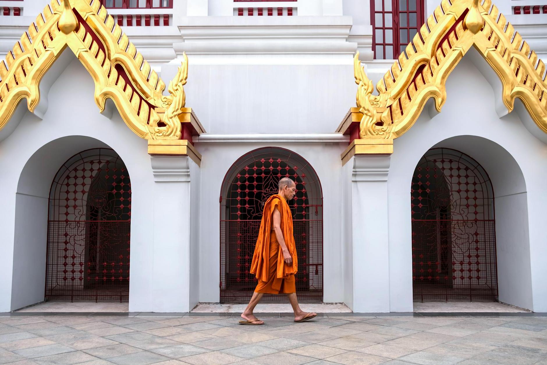 Buddhist Monk Walking by the Temple