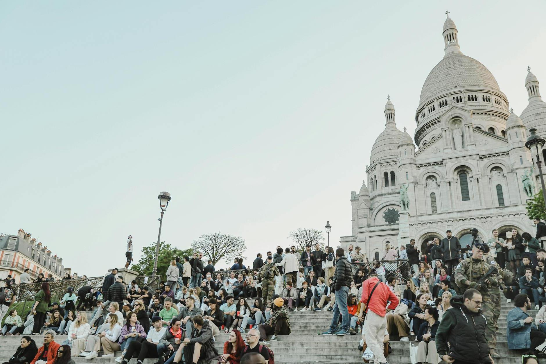 Tourists around Sacre Coeur Basilica at Montmartre Hill