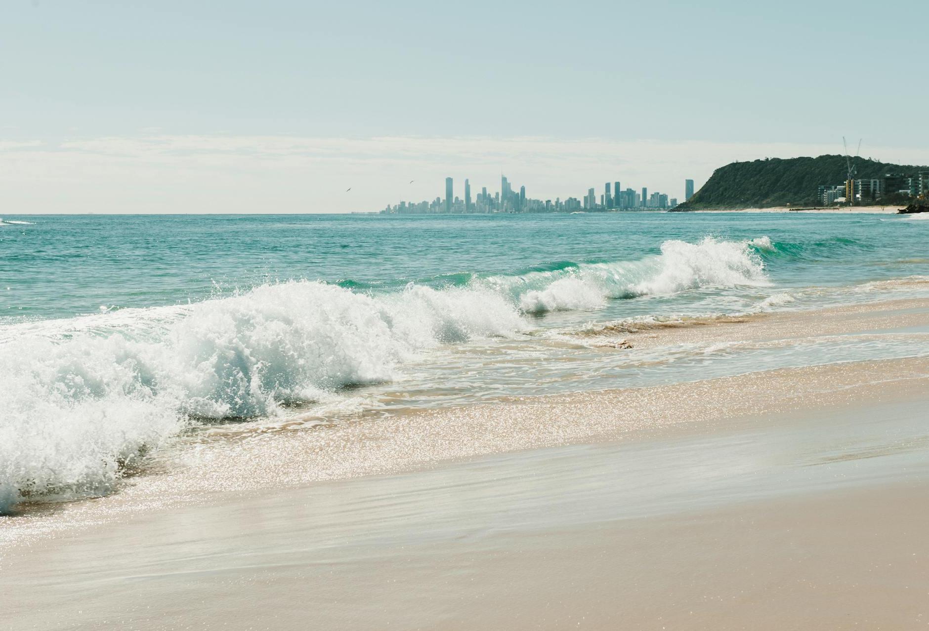Waves Rolling on a Beach with City Skyline Seen on the Horizon, Gold Coast, Queensland, Australia