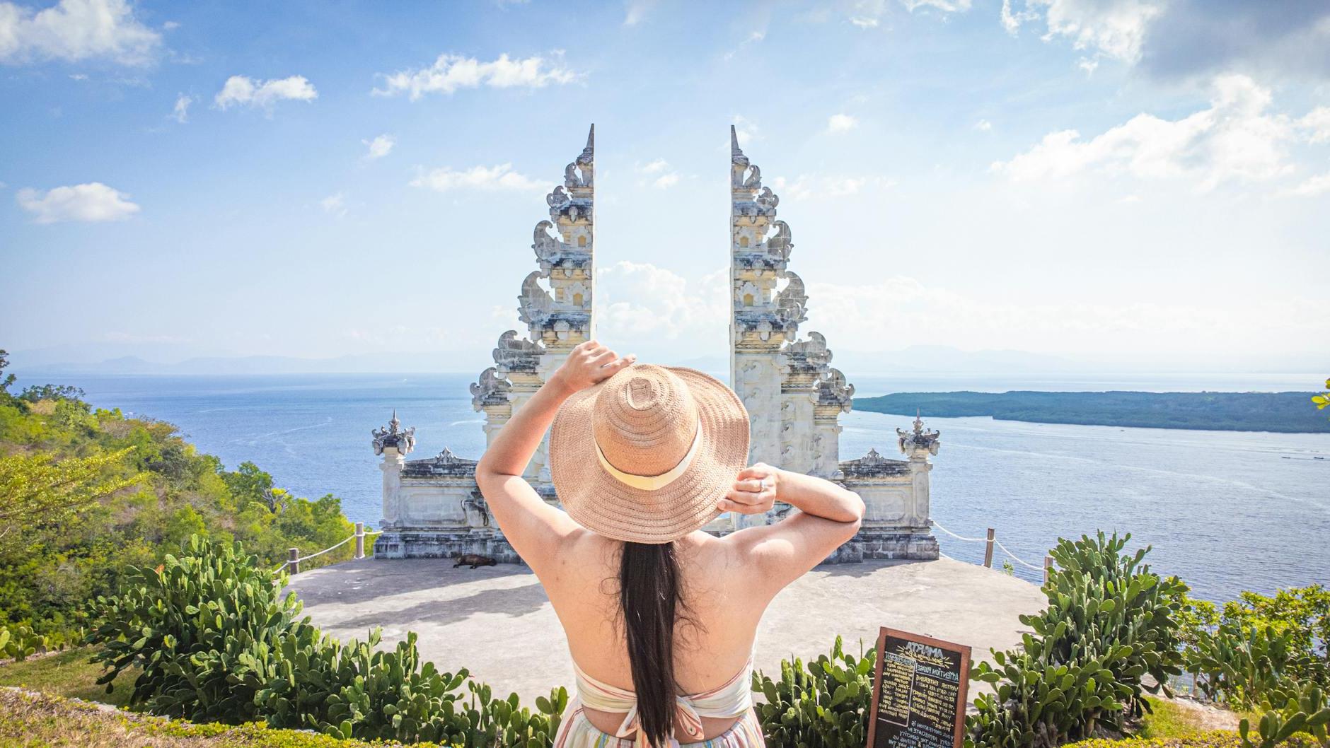 Tourist in Front of Split Gateway of a Temple