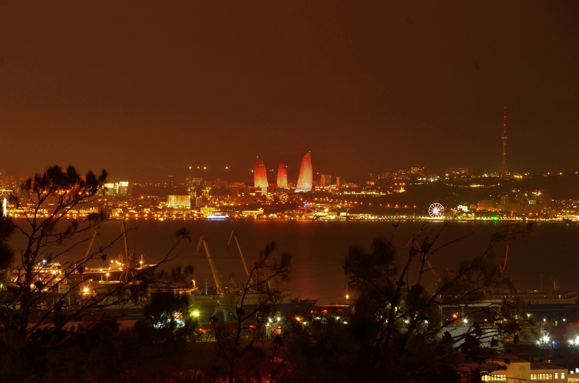 Illuminated Flame Towers in Baku City Skyline at Night