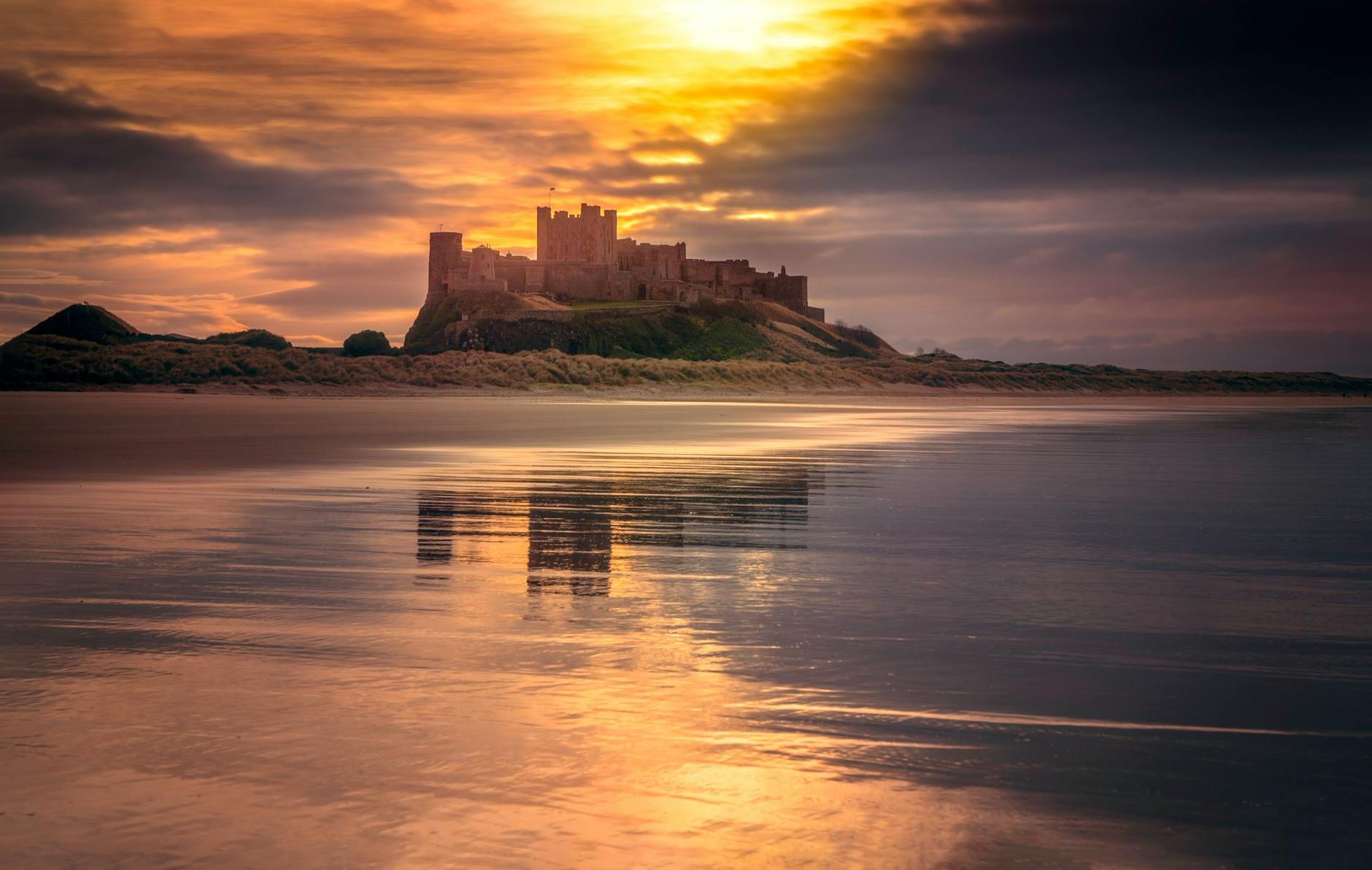 Castle Near Body of Water Under Golden Hour