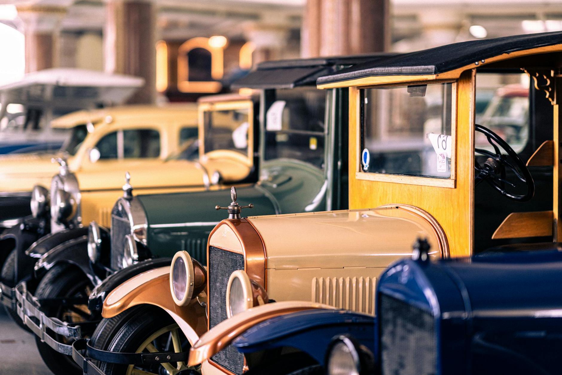 A Row of Antique Cars Exhibited in a Museum