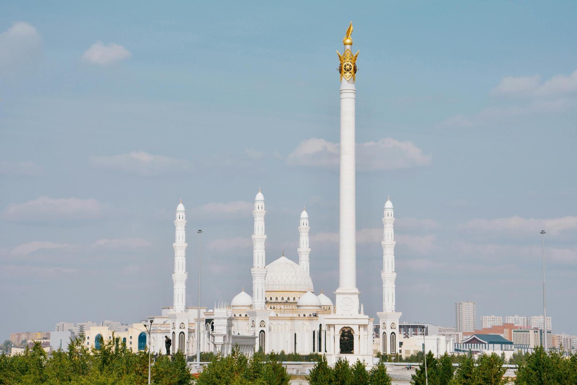 Photograph of a White Mosque with Minarets