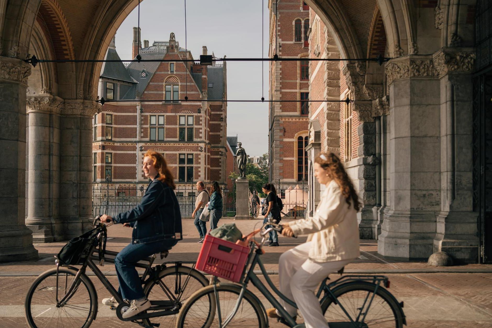 Women on Bicycles on the Streets of Amsterdam, the Netherlands 