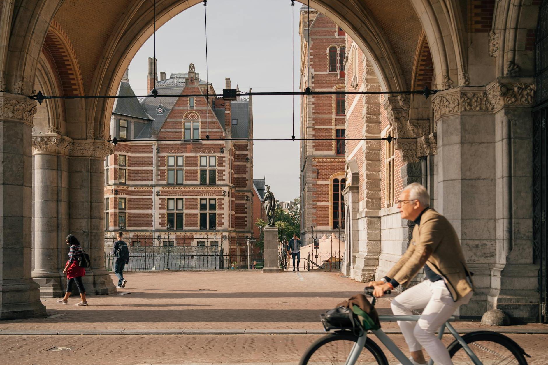 Man on a Bicycle on the Streets of Amsterdam, the Netherlands 