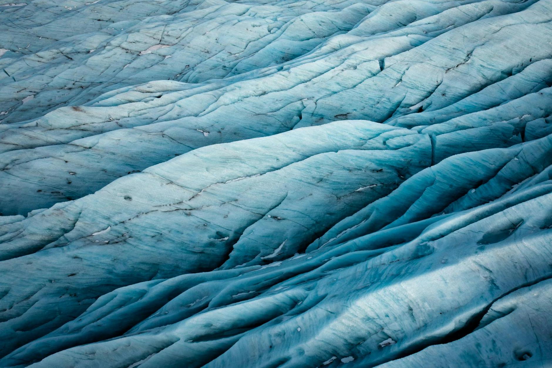 A close up of a blue glacier