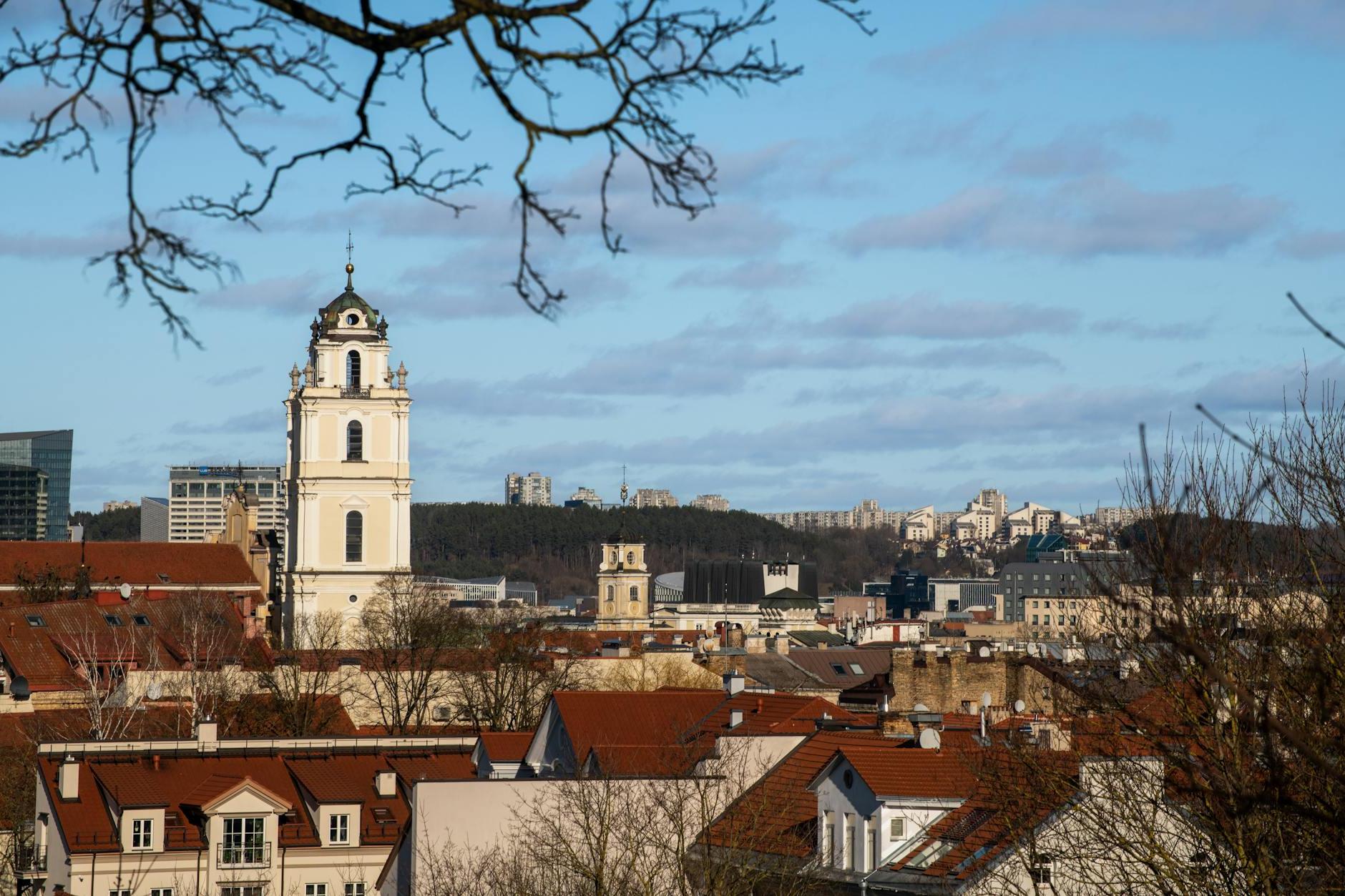 A view of a city with a church and a clock tower