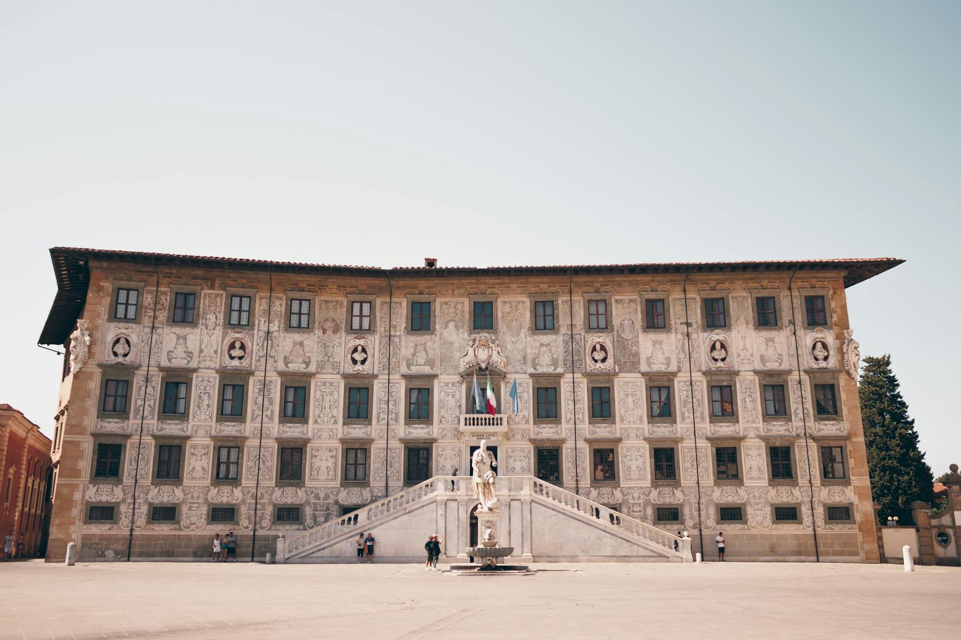 A large building with a statue in front of it