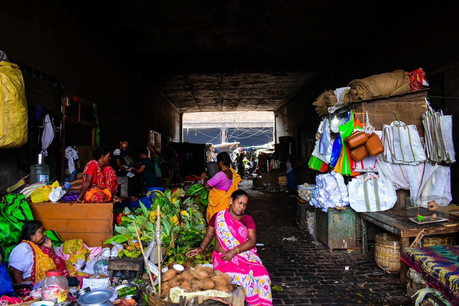 A woman sitting in a market