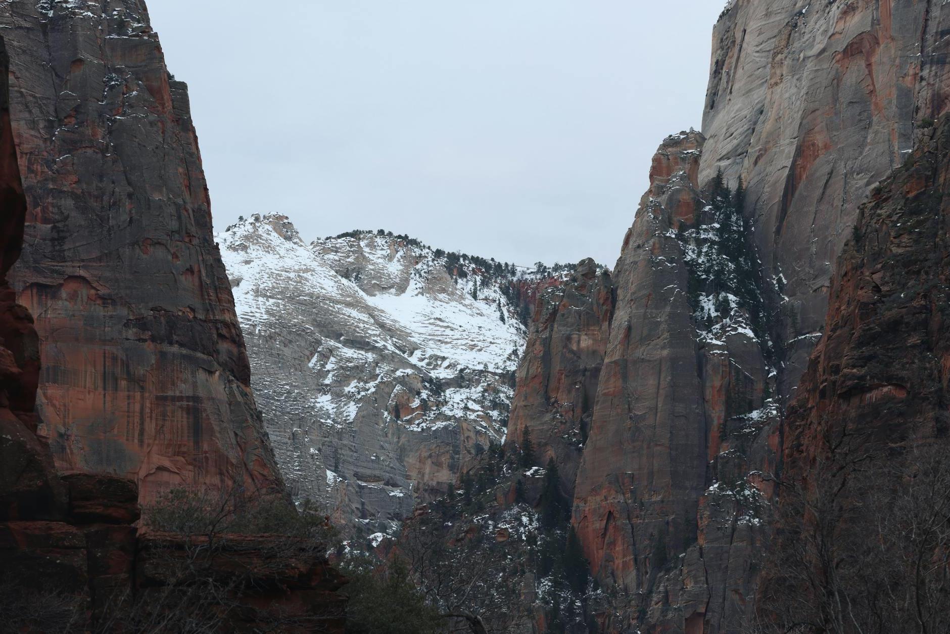 A view of the mountains and snow covered rocks