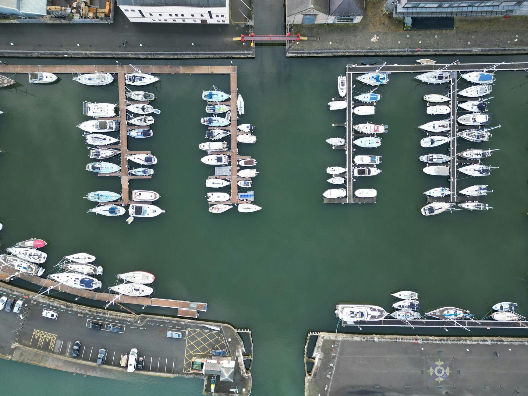 Aerial view of a marina with many boats