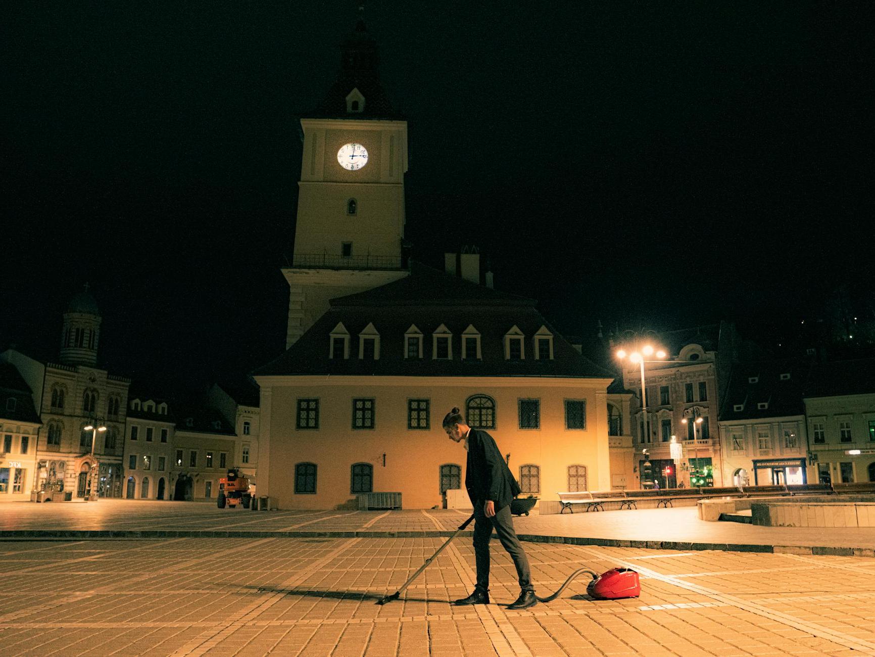 Man with Vacuum Cleaner at The Council Square in Brasov in Romania