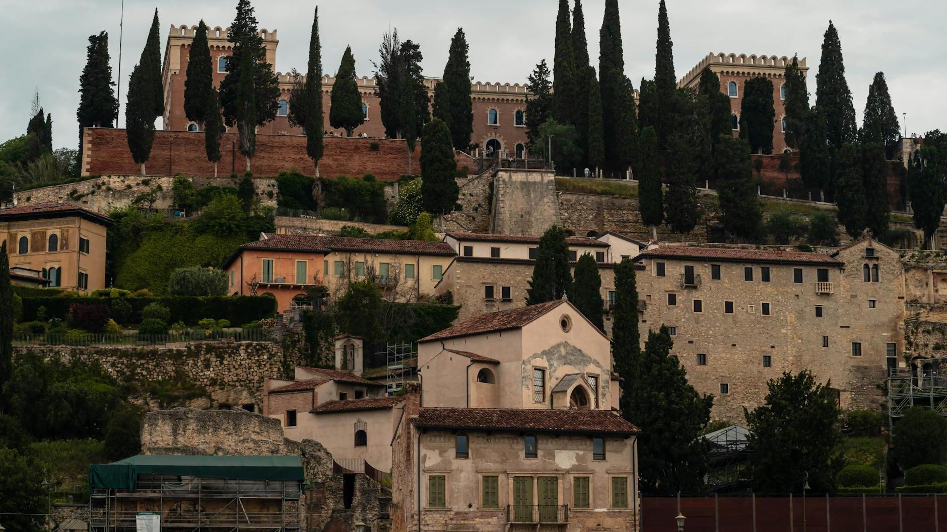 A view of a town with a castle on top