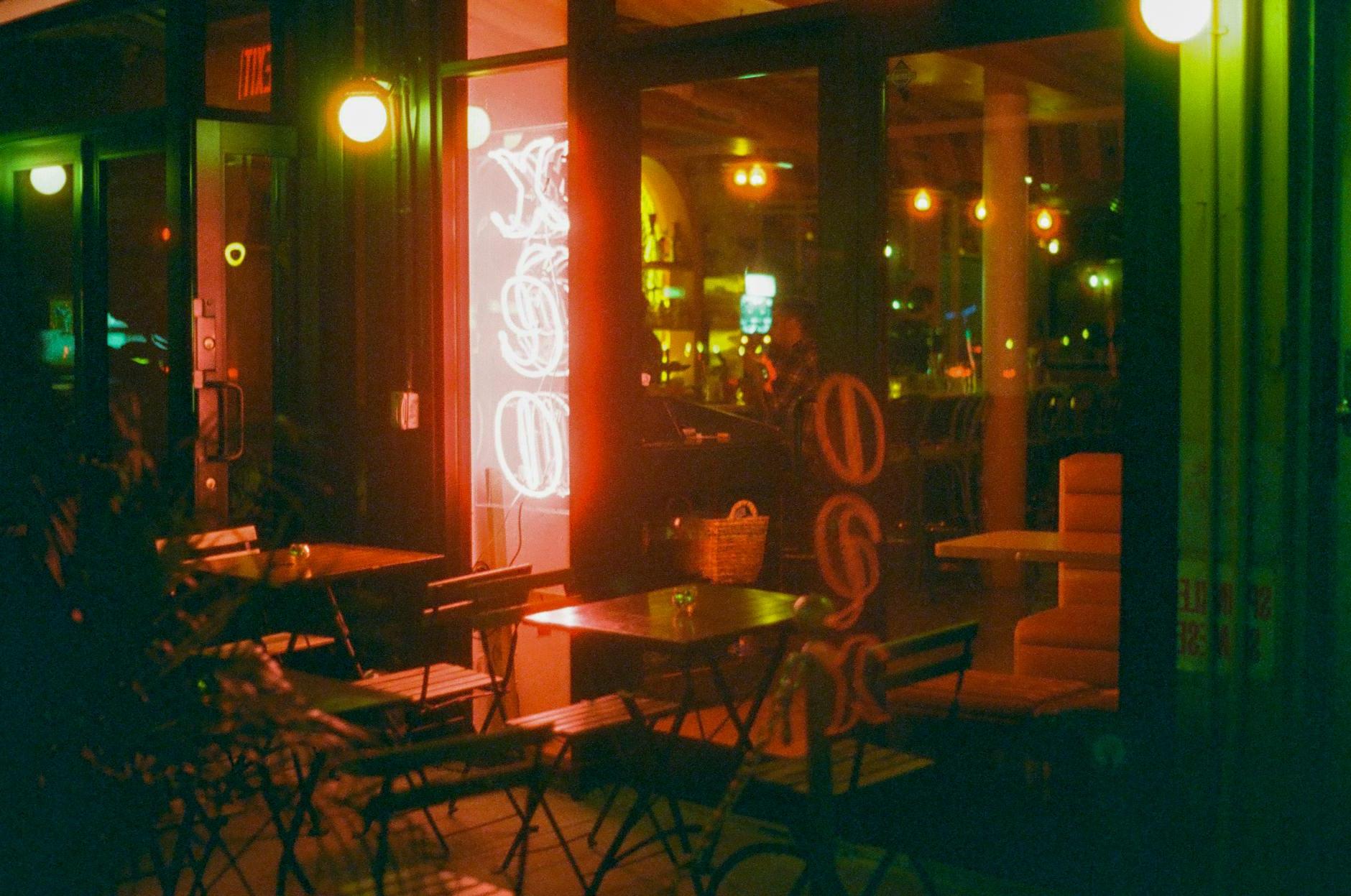 Lights over Restaurant Tables and Chairs at Night