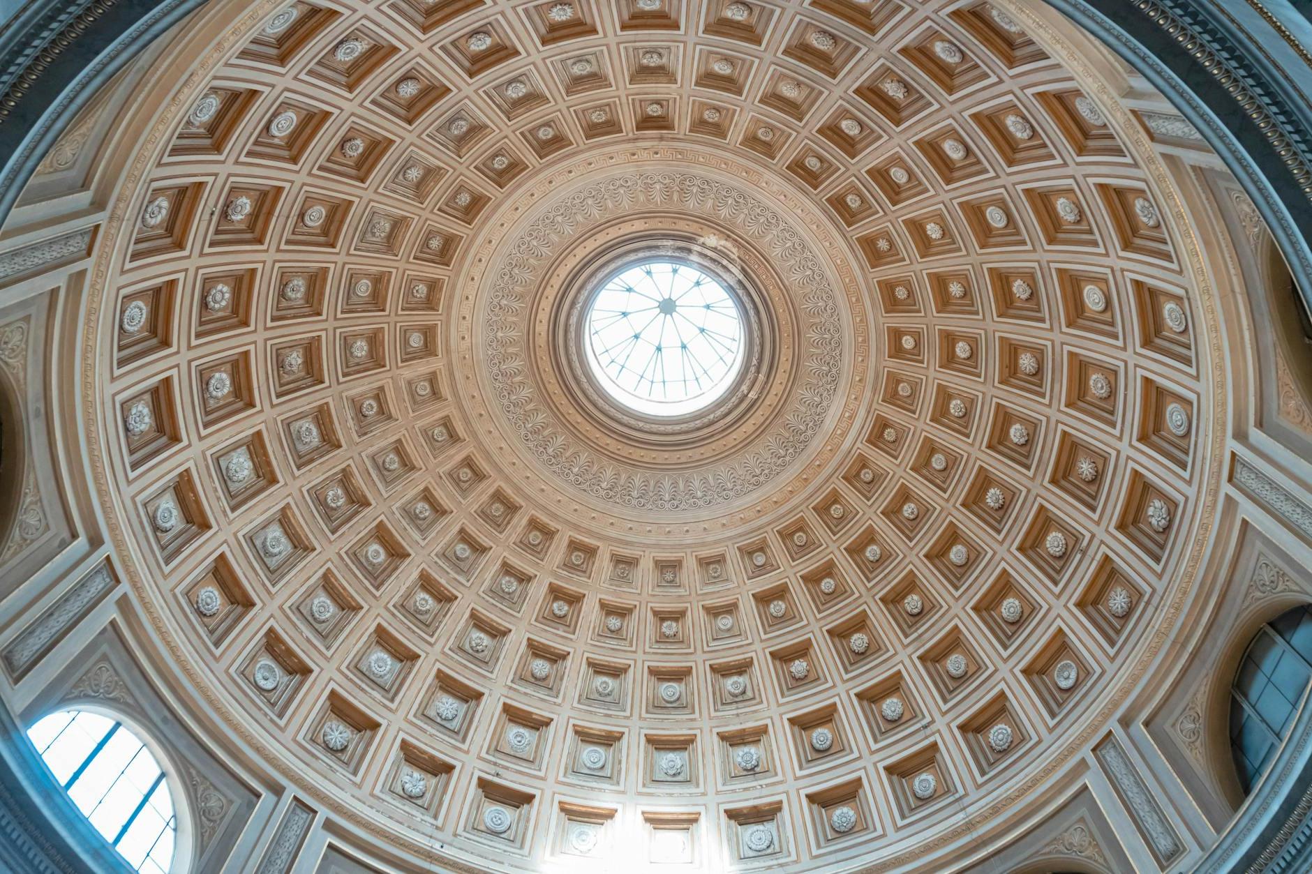 The ceiling of a circular building with a dome