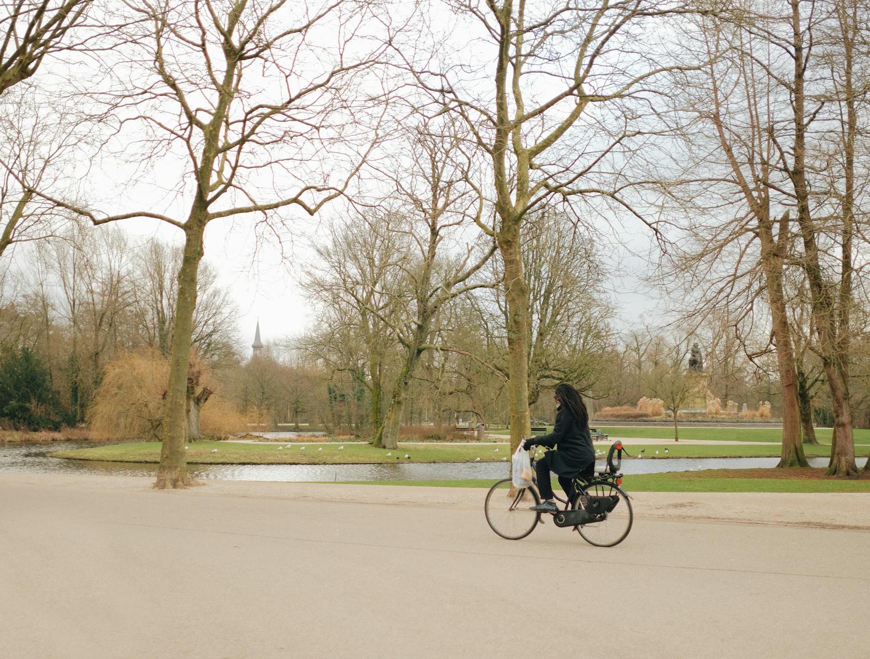 A person riding a bike down a road