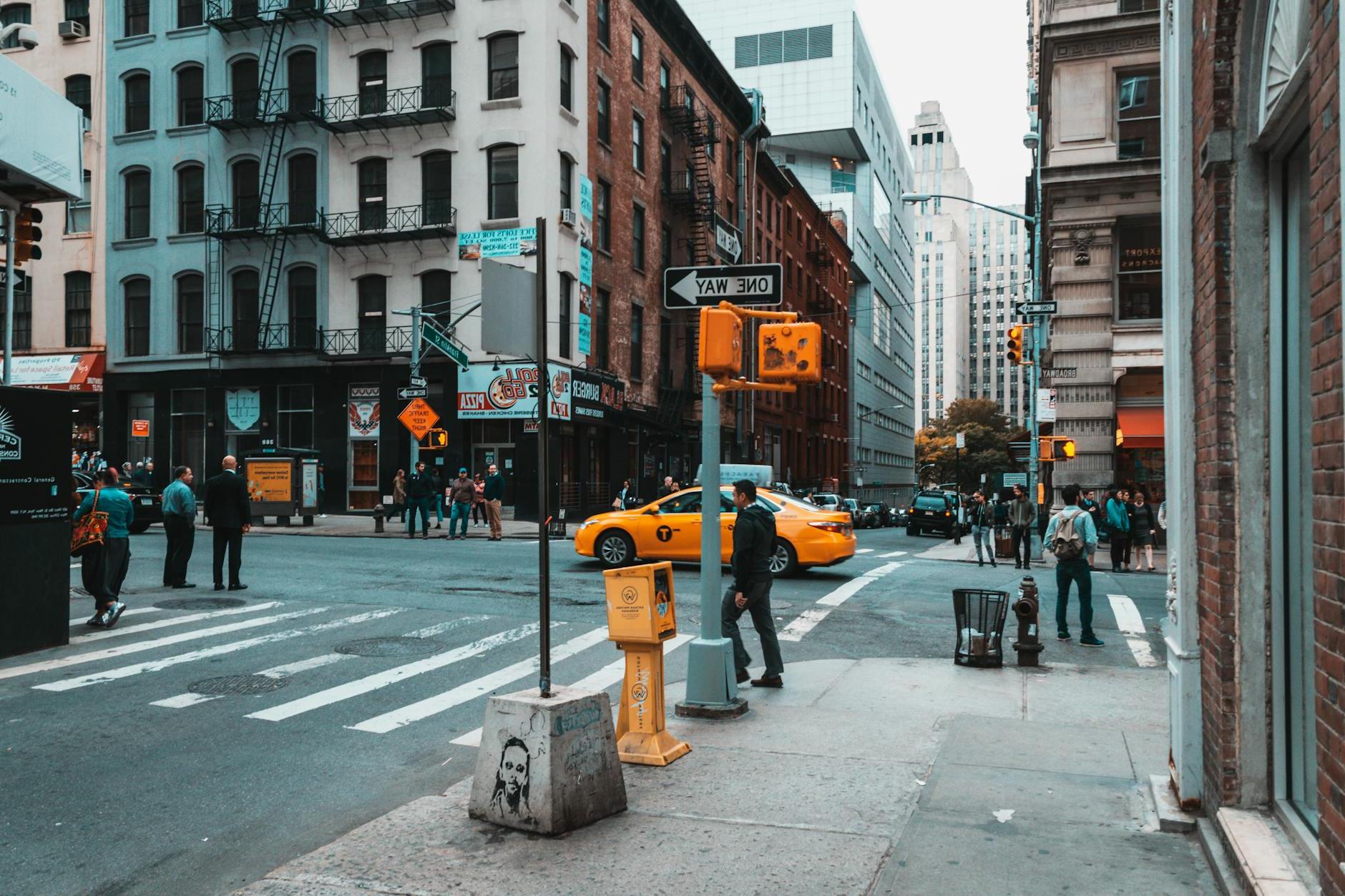 People Crossing Busy City Street