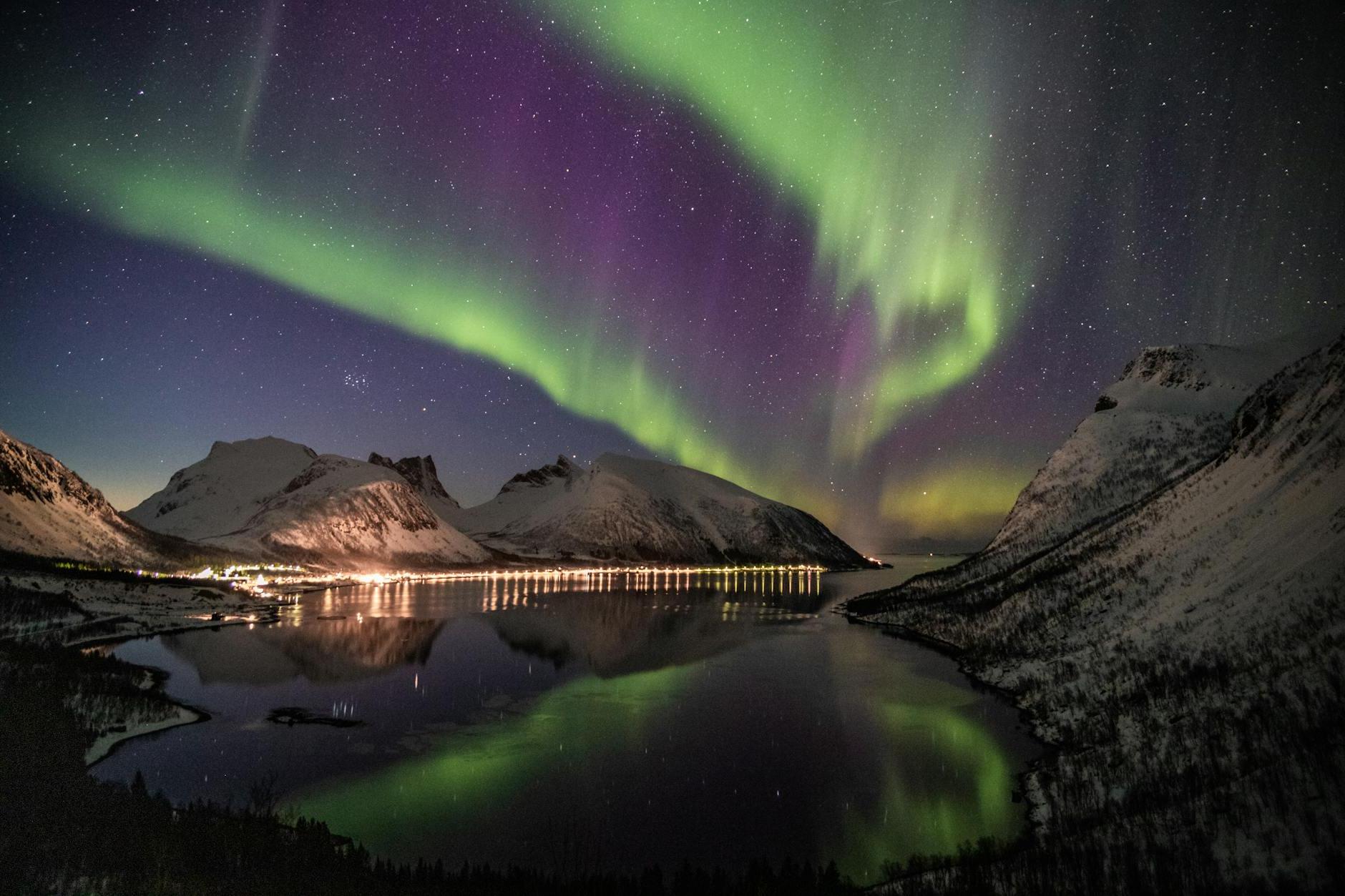 Northern Lights Near Snow-coated Mountains