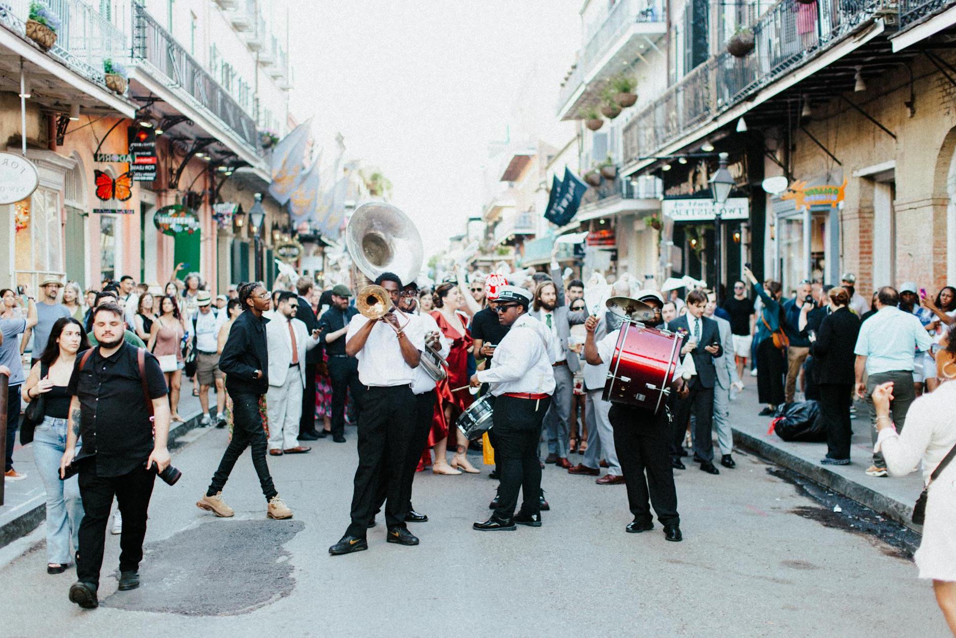 People Watching Musicians Playing at a Street Festivity in New Orleans, USA