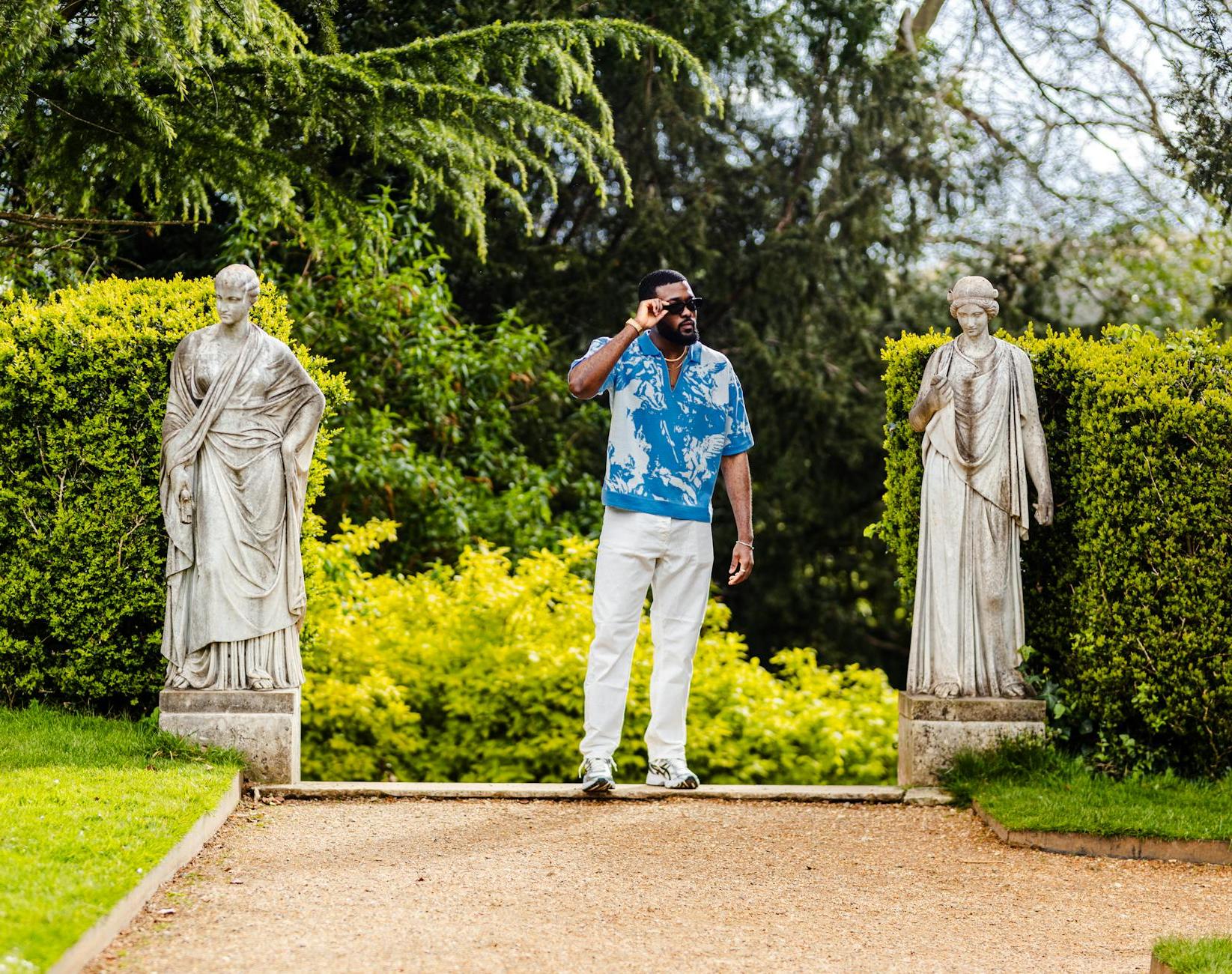 Man in White Pants Posing in Park