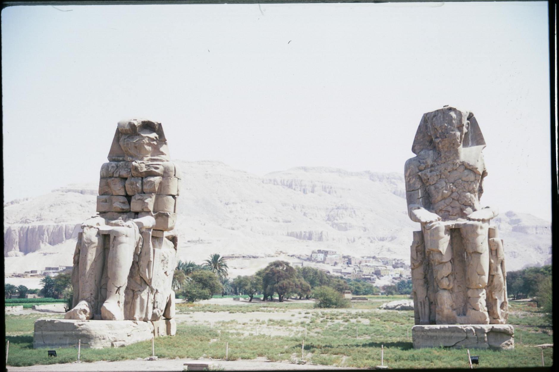 Two Grey Concrete Statues