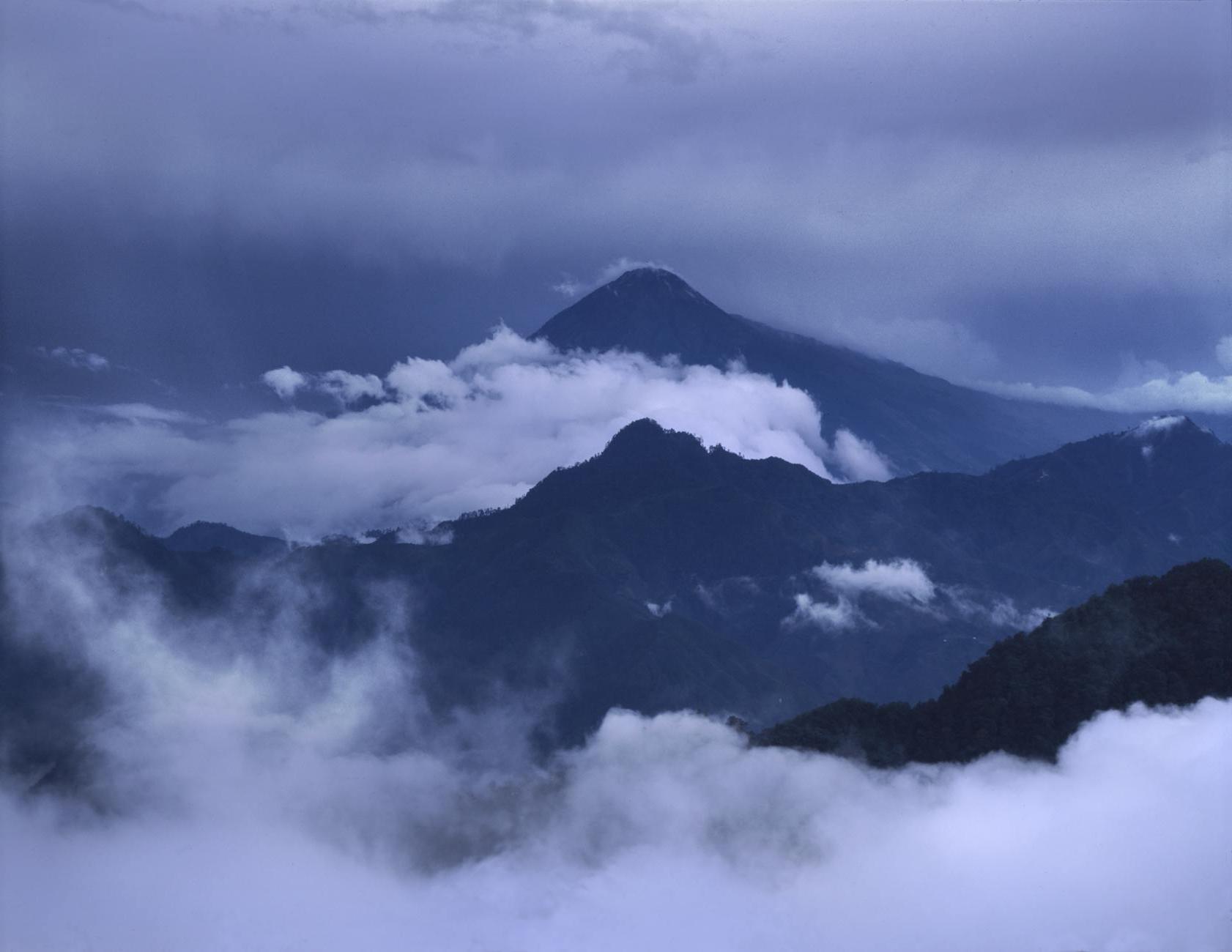 Black Mountain Covered in Clouds Photo