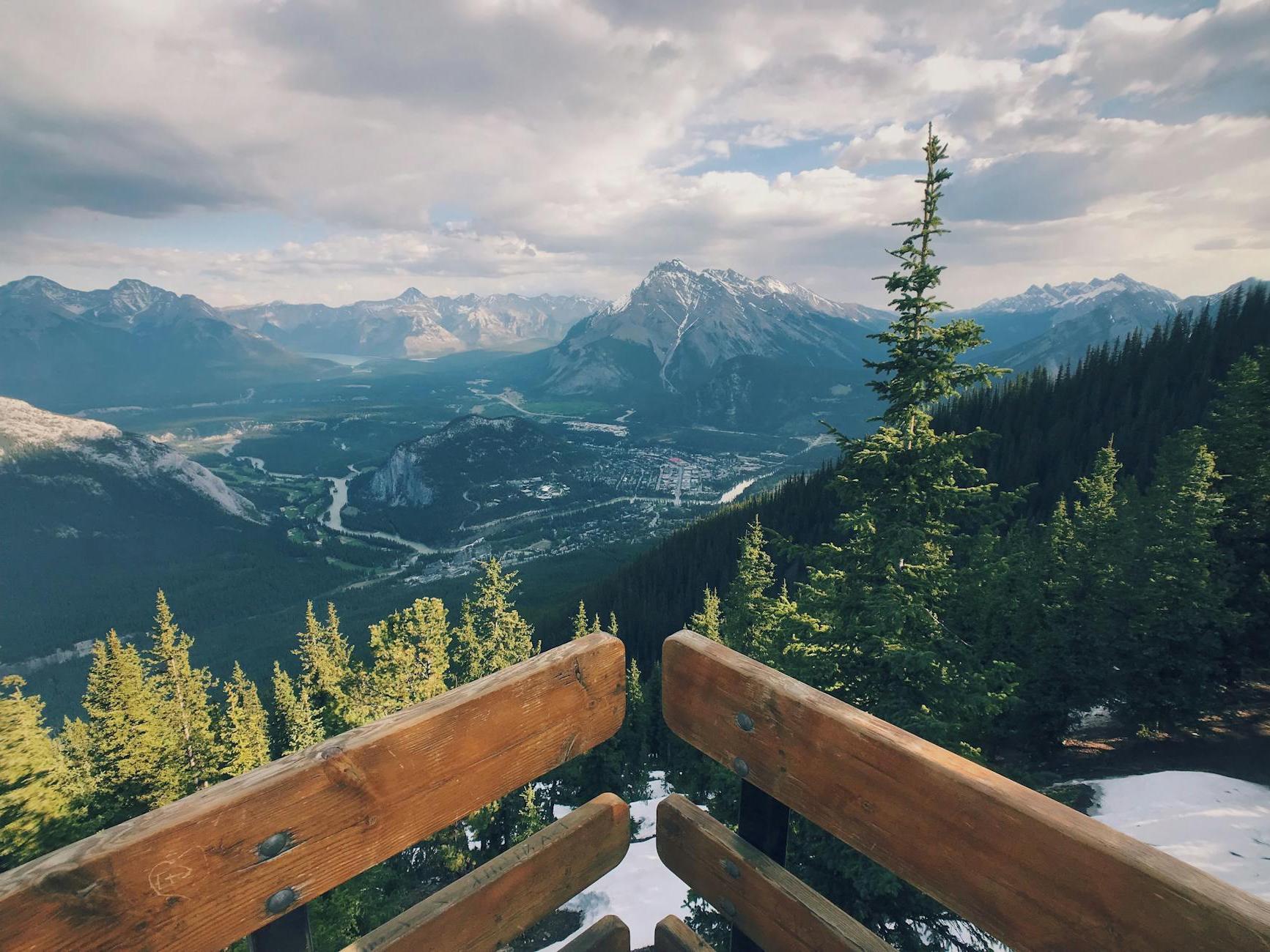 Scenic View Of Mountains Under Cloudy Sky