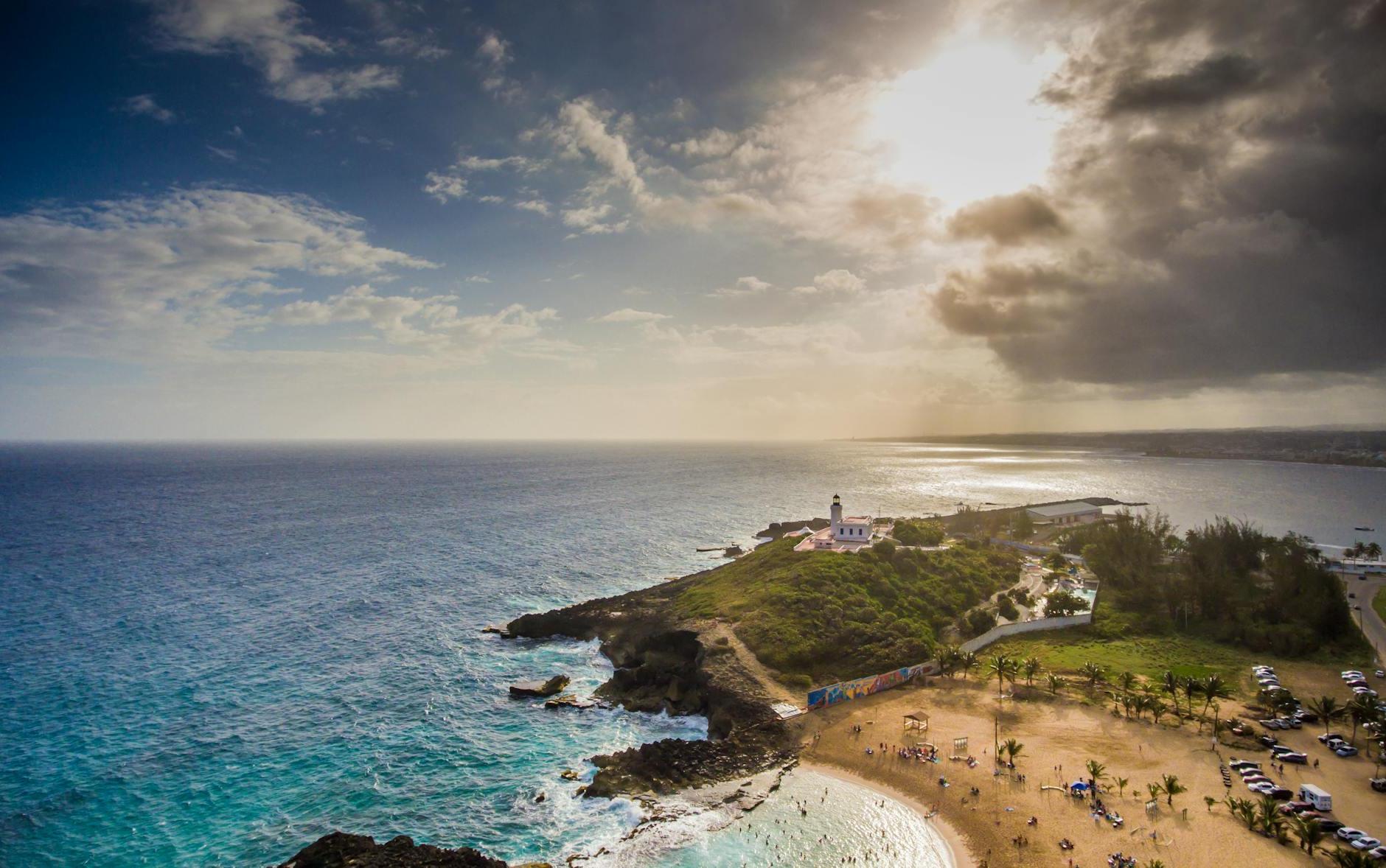 Island and Ocean Under A Cloudy Sky