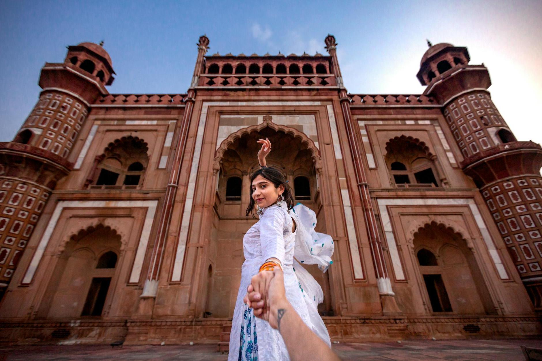 Woman Wearing White Dress Standing Near Building