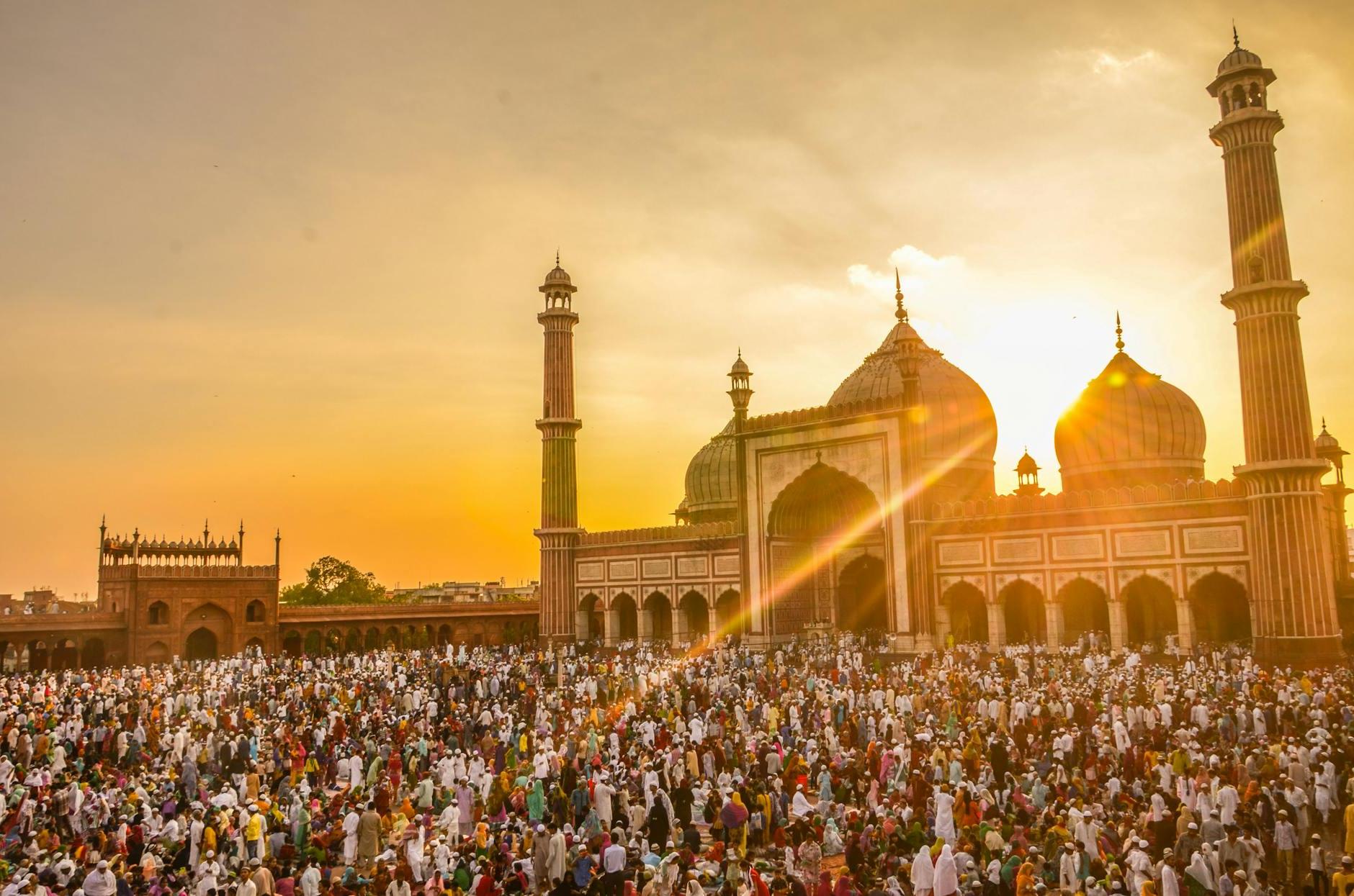 Photo Of People In Front Of Mosque During Golden Hour