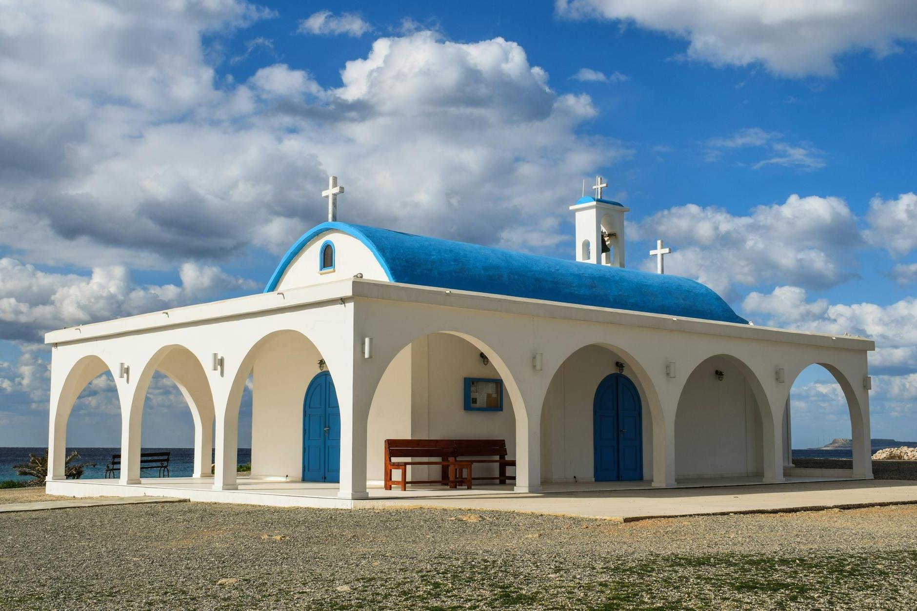 White and Blue Painted Church Under Blue Sky